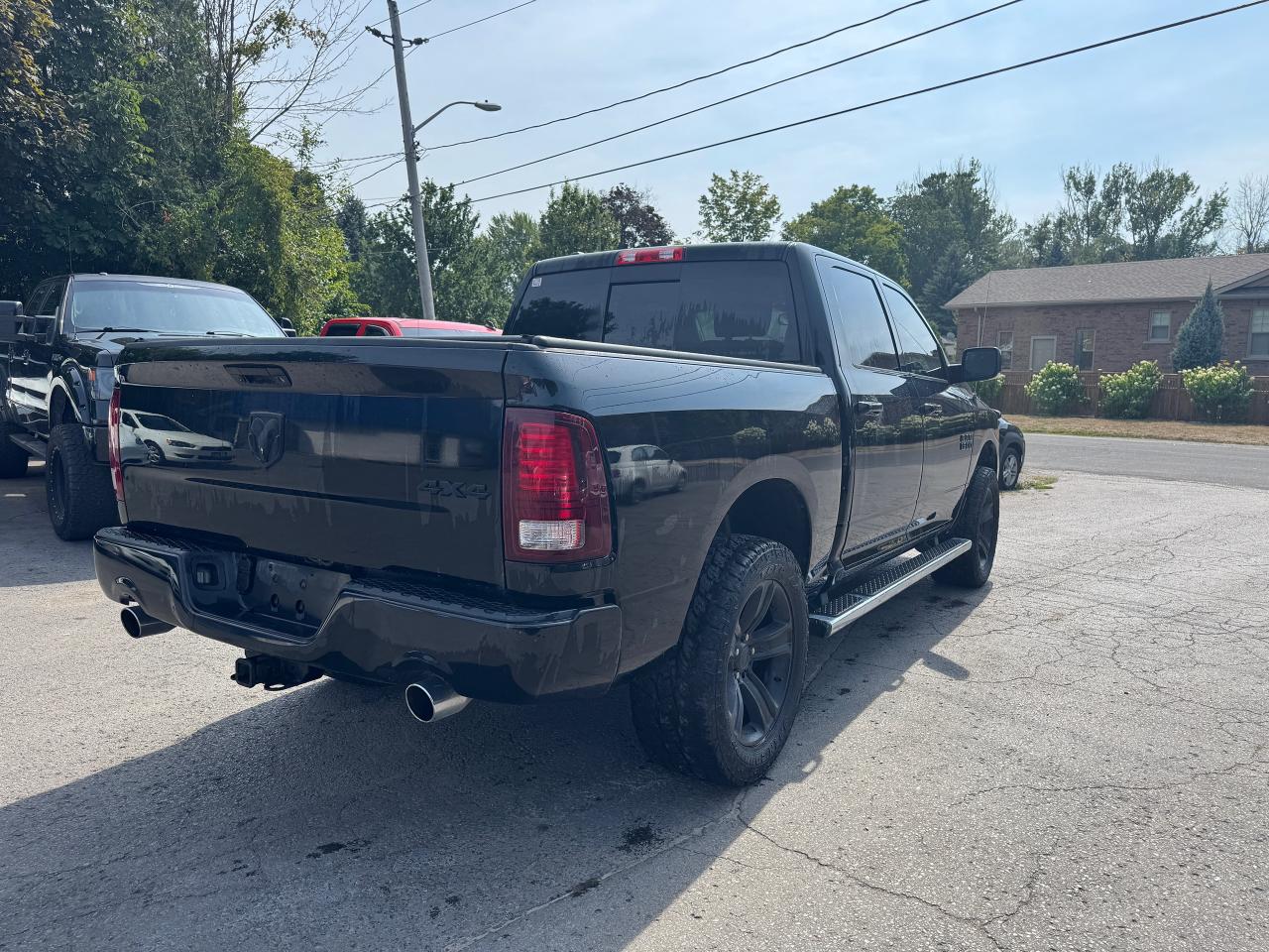 2014 RAM 1500 4WD Crew Cab 140.5" Sport - Photo #7