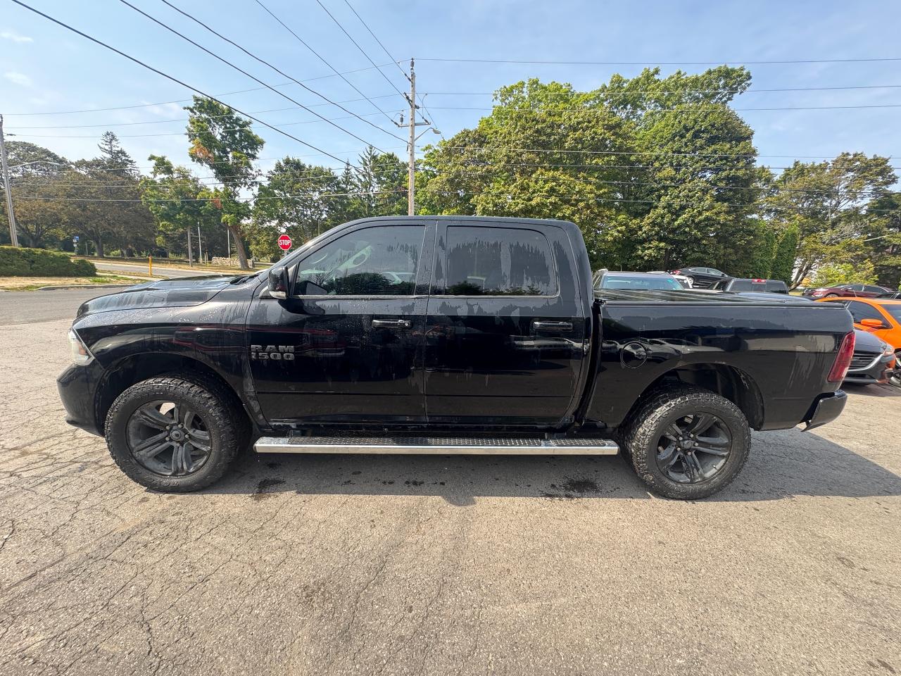 2014 RAM 1500 4WD Crew Cab 140.5" Sport - Photo #4