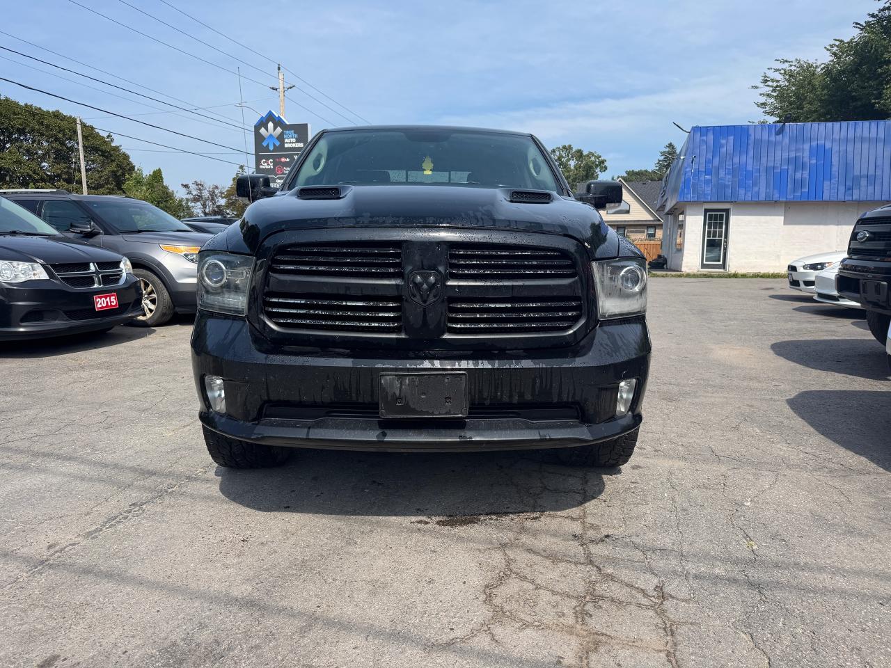 2014 RAM 1500 4WD Crew Cab 140.5" Sport - Photo #2