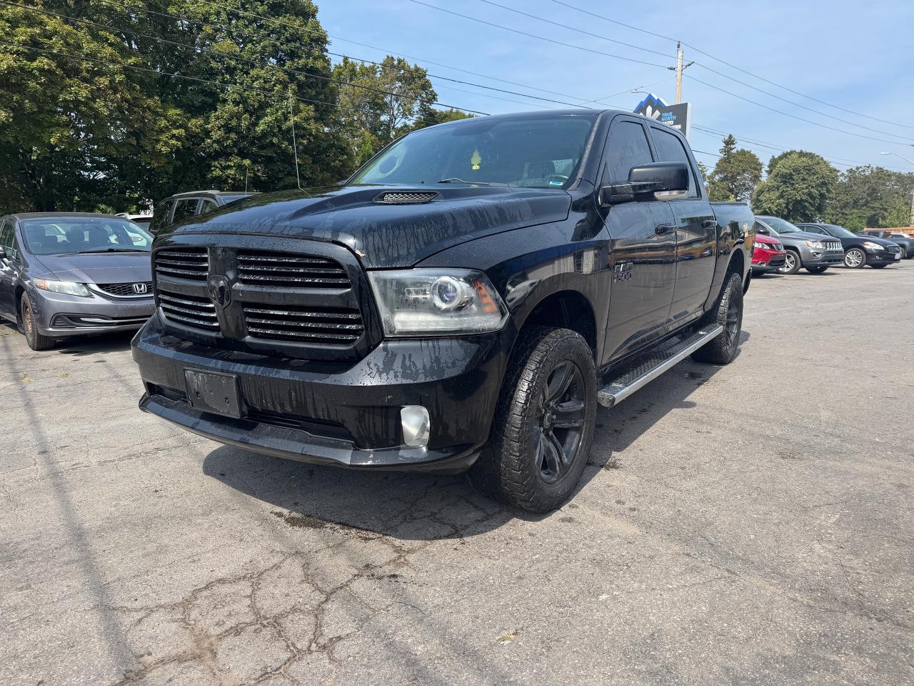 2014 RAM 1500 4WD Crew Cab 140.5" Sport - Photo #3