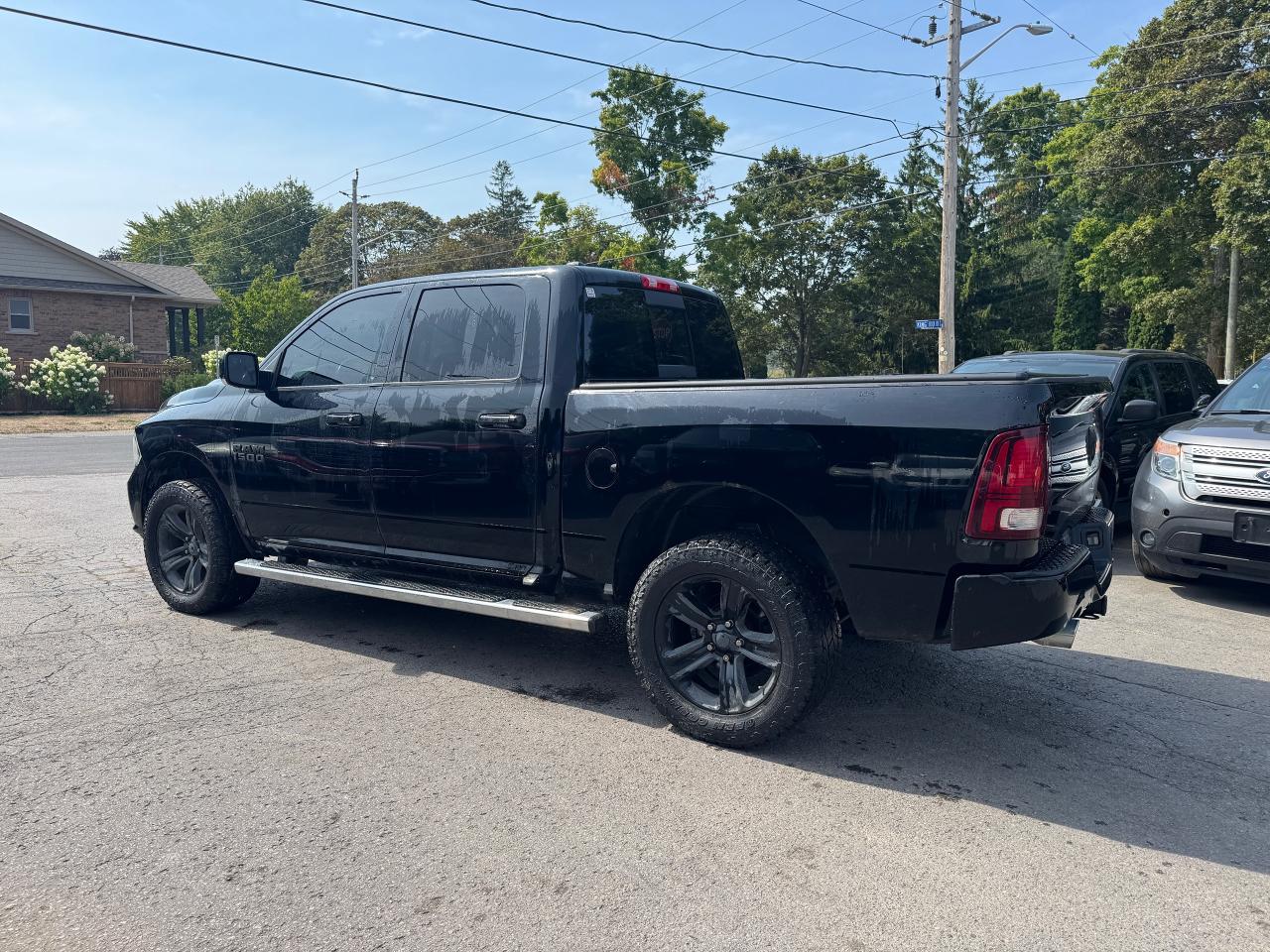 2014 RAM 1500 4WD Crew Cab 140.5" Sport - Photo #5