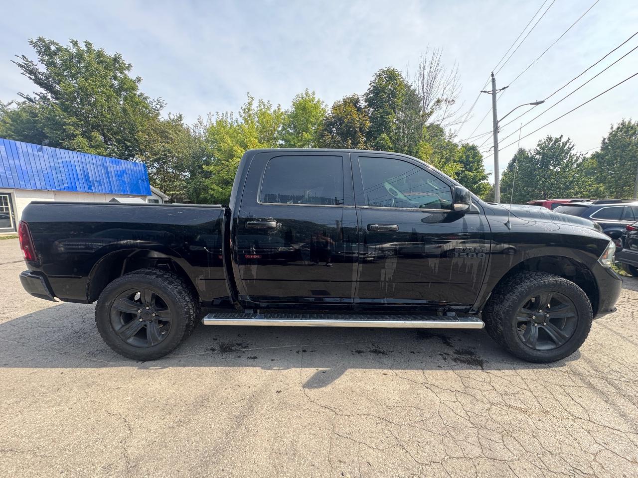 2014 RAM 1500 4WD Crew Cab 140.5" Sport - Photo #8