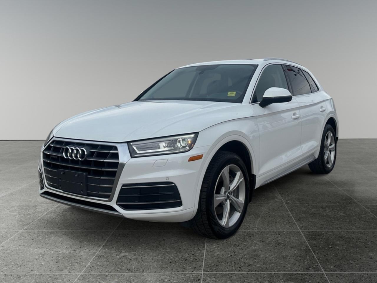 <b>Navigation, Sunroof, Leather Seats, Rear View Camera, Heated Seats, Heated Steering Wheel, Bluetooth, Aluminum Wheels, SiriusXM</b><br> <br> We sell high quality used cars, trucks, vans, and SUVs in Saskatoon, Regina, Prince Albert and overall Saskatchewan area.<br> <br>   This Audi Q5 is the segments most modern offering delivering a high degree of technology, comfort, and conservative style. This  2018 Audi Q5 is for sale today. <br> <br>Theres something special that sets this Audi Q5 that sets it apart from the dozens of luxury crossovers available. Maybe its the contemporary, yet timeless exterior styling. Maybe its the unique balance of fun, sporty performance with the versatility of expanded interior volume. It might be the exhilaration of the steering wheel in your hands or the thrills it commands while you take in the winding road ahead. No matter your reasons, you have the capability to leave tracks where your journey takes you - in the one vehicle that is ready to leave its impression on you. This  SUV has 141,319 kms. Its  white in colour  and is completely accident free based on the <a href=https://vhr.carfax.ca/?id=XRhKlt5r00hgbGoji0Vr551fIfK5t+gc target=_blank>CARFAX Report</a> . It has a 7 speed automatic transmission and is powered by a  252HP 2.0L 4 Cylinder Engine.  <br> <br> Our Q5s trim level is 2.0 TFSI quattro Progressiv. The Progressiv trim adds some nice features to this versatile Q5. It comes with an 8.3-inch display radio with navigation, Bluetooth, SiriusXM, a USB port, and 10-speaker audio, a rearview camera, parking sensors, leather seats which are heated in front, a heated, leather-wrapped steering wheel with audio and cruise control, dual-zone automatic climate control, a power sunroof, a chrome grille, aluminum wheels, and more.<br> <br/><br><h3 style=margin-top: -20px;>More about the Dealership:</h3><br>

Looking for a <i>used car dealership in Saskatchewan</i> you can truly count on? With over <b>50 years in the auto industry</b>, weve earned a solid reputation built on trust, quality service, and lasting customer relationships.<br><br>

Our team is here to guide you through every step of your car-buying journey - from car-buying expert advice to <b>flexible financing</b> through our <b>Credit Repair program</b>. With over 100 well-priced used vehicles in stock, we make it easy for you to drive home happy. We offer <b>Delivery</b> anywhere in Saskatchewan.<br><br>

As the trusted used car dealership in Saskatoon, Regina, Prince Albert; we are committed to an excellent customer experience. <br><br> o~o