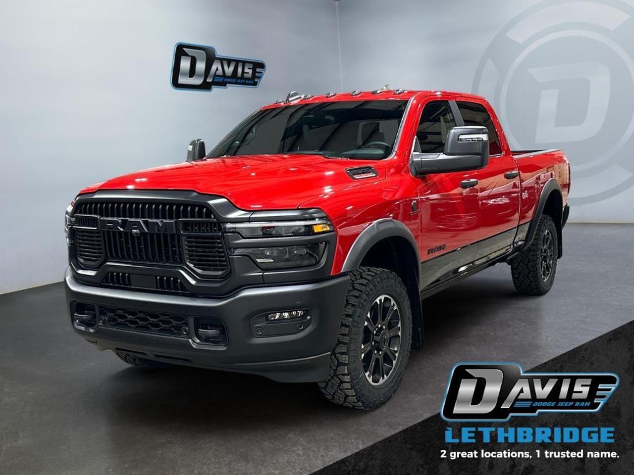 <b>Navigation, Heated Seats, Blind Spot Detection, Remote Start, Heated Steering Wheel!<br /> <br /></b><br /> <br /> <br />Conquer any terrain with the 2026 Ram 2500 Rebel Crew Cab in Flame Red two-tone/Diamond Black Crystal. Powered by a 6.7L Cummins Turbo Diesel I6 engine paired with an 8-speed TorqueFlite HD automatic transmission and 4x4 drivetrain, this Rebel delivers unmatched towing, payload, and off-road performance.<br /><br />Designed for adventure, it features the Rebel Performance Suspension, 20 Black Diamond-Cut aluminum wheels with LT285/60R20 all-terrain tires, powder-coated bumpers, LED lighting, and MOPAR spray-in bedliner. The interior blends comfort and tech with heated cloth 40/20/40 power bench seats, rear 60/40 fold-flat seating, Uconnect 5 NAV with 12 touchscreen, Apple CarPlay, Android Auto, Alexa built-in, and 6-speaker audio system.<br /><br />Safety and convenience include adaptive cruise control with stop, ParkView rear camera, ParkSense front/rear assist, blind-spot monitoring with cross-path detection, tow hooks, Class V receiver hitch, and trailer sway damping. Rugged yet refined, the 2026 Ram 2500 Rebel is ready for both work and off-road adventures.<br /> <br />To apply right now for financing use this link: <a href=https://lethbridge.davisdodge.ca/free-credit-check/ target=_blank rel=nofollow noopener noreferrer>https://lethbridge.davisdodge.ca/free-credit-check/</a><br /><br /> <br /><br />As a premier Chrysler, Dodge, Jeep and RAM dealership, Davis Dodge proudly offers an extensive selection of new and used vehicles to meet every drivers needs. Customers across Lethbridge, Fort Macleod, Taber, Claresholm, Coaldale, and beyond trust us for daily vehicle specials, certified service and parts, and a seamless online inventory experience. <br /><br /> With competitive financing options and expert support, we make car buying easy and enjoyable. <br /><br /> Ready to hit the road? Schedule your test drive today at Davis Dodge, your trusted Chrysler, Dodge, Jeep and RAM dealer in Lethbridge, Alberta.<br /><br /> Vehicle pricing offer shown expires 2026-04-30. <br /> Come by and check out our fleet of 60+ used cars and trucks and 110+ new cars and trucks for sale in Lethbridge. o~o