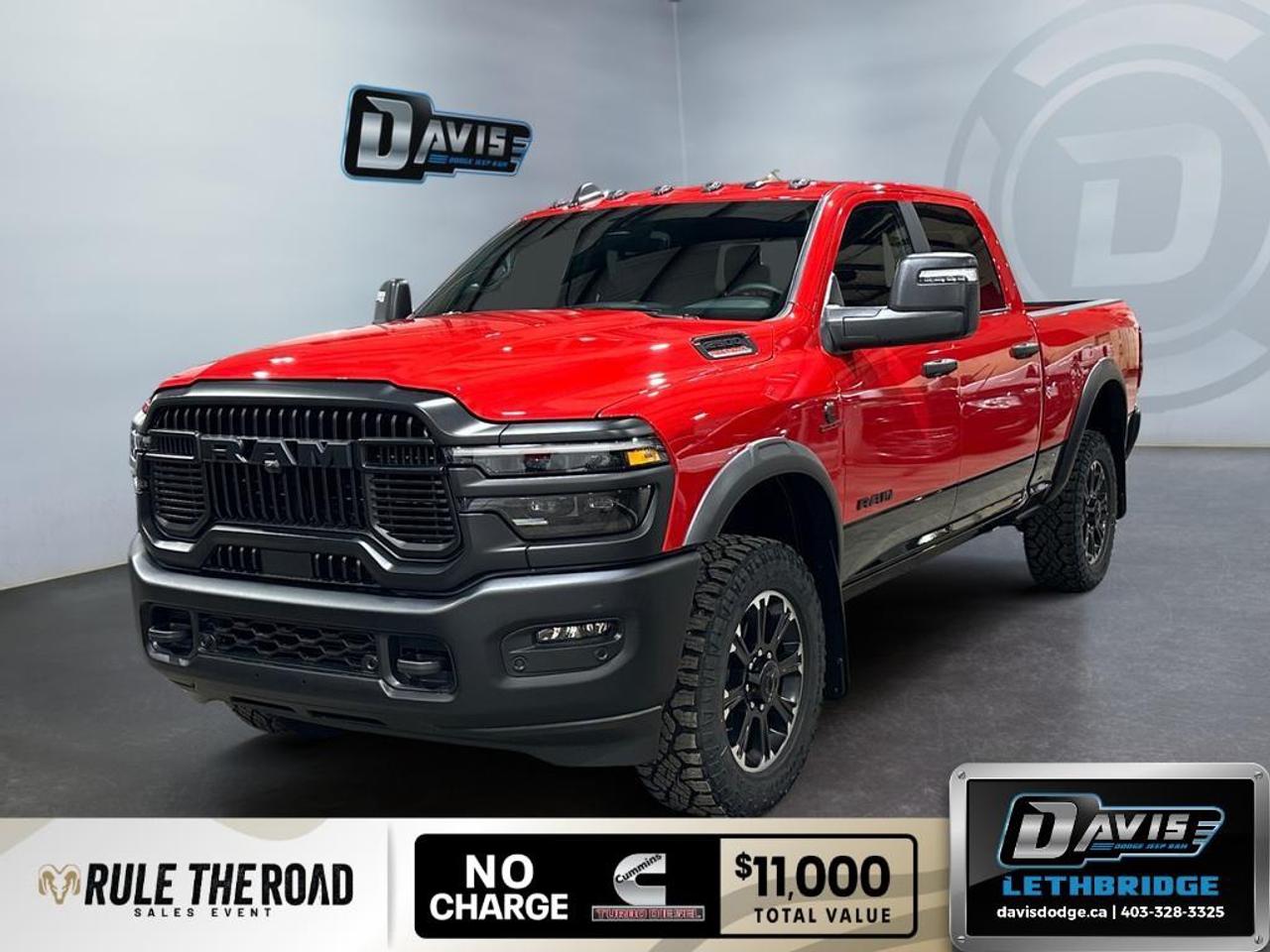 <p>Introducing the powerful 2026 Ram 2500 Rebel 4x4 Crew Cab, adorned in a bold Flame Red finish. This new truck features a reliable 4×4 drivetrain and effortless handling thanks to the advanced Rebel Performance Suspension.</p><p><strong>Interior Features:</strong></p><ul><li>Spacious black interior with heated front seats for ultimate comfort</li><li>Leather steering wheel with included heated steering feature</li><li>Power seats and windows for convenience</li><li>Air conditioning ensuring a pleasant drive</li></ul><p><strong>Exterior Features:</strong></p><ul><li>Distinct Rebel styling with Lower Two-Tone Paint</li><li>Alloy wheels offering a sturdy and sleek profile</li><li>Parking sensors and backup camera for easy maneuverability</li><li>Heavy-duty engine cooling with a Diesel Exhaust Brake system</li></ul><p><strong>Technology & Safety Features:</strong></p><ul><li>Adaptive Cruise Control for relaxed highway drives</li><li>Advanced navigation system for top-tier route planning</li><li>Bluetooth connection complemented by a satellite radio and Wi-Fi hotspot</li><li>Lane assist and brake assist for enhanced road safety</li><li>Smart device integration keeping you connected on the go</li></ul><p>This powerful pickup is ideal for those needing reliability and performance in their adventures. Whether you're an off-road enthusiast or a city hauler, the Ram 2500 Rebel's premium features aim to elevate your driving experience. Reach out to Davis Dodge Lethbridge for more information or to schedule a test drive today!</p>