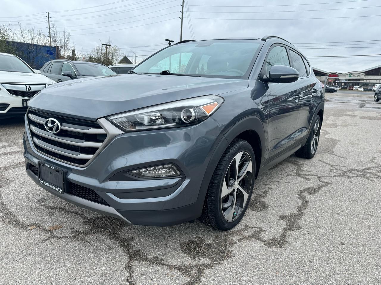 <div>2016 Hyundai Tucson Limited AWD comes in excellent condition,,,,CLEAN CARFAX REPORT,,,,runs & drives like brand new... Equipped with Backup Camera, Navigation System, Panoramic Sunroof, Leather Interior, Power seats, Power Steering Wheel, heated steering wheel, Power mirrors, heated mirrors, heated seats, Power doors lock, Bluetooth, Cruise Control and much more....Fully certified included in the price, HST & Licensing extra, this vehicle has been serviced in 2017, 2018, 2019, 2020, 2021 & up to recent in Hyundai Store...Service Records available upon request...Financing available with the lowest interest rates and affordable monthly payments............Please contact us @ 4 1 6 5 4 3 4 4 3 8 for more details....At Rideflex Auto we are serving our clients across G.T.A, Toronto, Vaughan, Richmond Hill, Newmarket, Bradford, Markham, Mississauga, Scarborough, Pickering, Ajax, Oakville, Hamilton, Brampton, Waterloo, Burlington, Aurora, Milton, Whitby, Kitchener London, Brantford, Barrie, Milton.......</div><div>Buy with confidence from Rideflex Auto... &nbsp; &nbsp; &nbsp; &nbsp;</div><div><br></div><div><br></div>