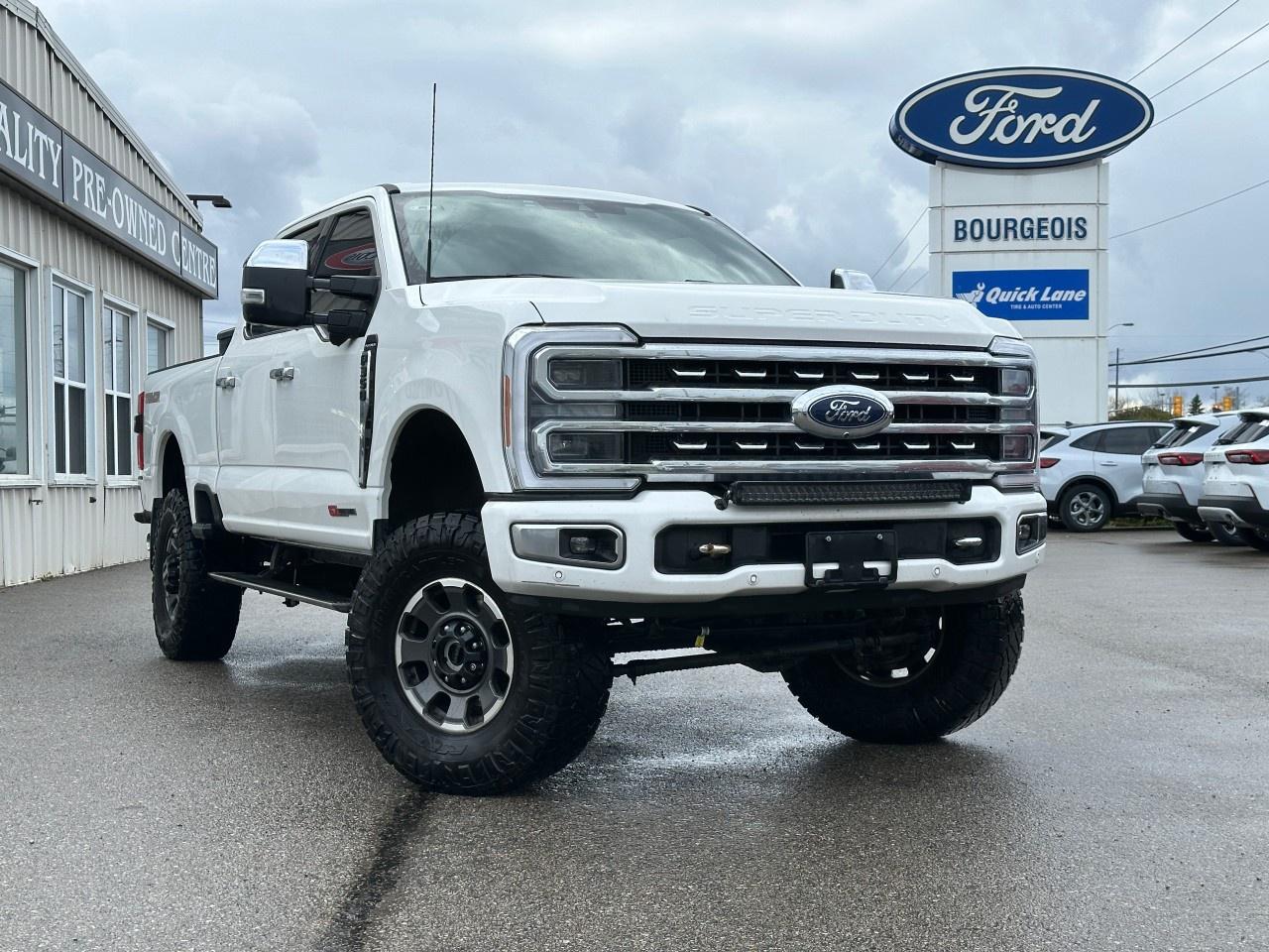 <p>Experience unparalleled power and style with the 2023 Ford Super Duty F-350 SRW Platinum in striking white, featuring a robust 4x4 drivetrain that ensures a commanding presence on any terrain. This is a truck built for those who demand the very best in performance and handling.</p><p>The exterior of this Super Duty exudes confidence and capability, ready to tackle the toughest of jobs while turning heads on the street. Slide inside to a sophisticated cabin with a sleek black interior where luxury meets functionality, boasting leather trim, a leather steering wheel, and leather seats for unmatched comfort. This Platinum trim comes fully equipped with modern amenities such as power windows, keyless entry, and a host of smart device integration options.</p><p>Technologically advanced, this Ford Super Duty includes a backup camera, wi-fi hotspot, and bluetooth connection to keep you connected and safe on the go. Safety features like adaptive cruise control and brake assist provide peace of mind, while driver assistance technologies enhance your driving experience. The convenience of a heated steering wheel and heated seats ensures comfort in any climate, with the added option of cooled front seats for those warmer days.</p><p>This truck is perfect for those seeking a dependable workhorse with luxurious touches and cutting-edge technology. Whether youre on the job site or taking a long drive, the 2023 Ford Super Duty F-350 SRW Platinum delivers on all fronts. Contact our dealership today to learn more and make this extraordinary vehicle yours.</p> <p><strong>Why Choose the Bourgeois Auto Group?</strong></p><p>For 80 years, Bourgeois Auto Group has been delivering exceptional automotive experiences. Our factor trained teams work to ensure you receive the shopping experience you deserve; whether you're looking for a new or new-to-you vehicle.</p><p>Shop 24/7 with our online showroom and chat service, ensuring convenience every step of the way. No hidden fees, full disclosure, and every pre-owned vehicle comes with a Carfax® report for peace of mind.</p><p>We offer a wide selection of pre-owned vehicles, all competitively priced using real-time market data. Get the best deal on your purchase and trade-in with our free Live Market Analysis report.</p><p>Looking to sell your car? We buy any make or modelno purchase required. Our simple to use online trade valuation tool will provide you with a clear, transparent selling experience whether you buy our car or not.</p><p>Backed by hundreds dedicated employees across 4 convenient locations, were here to meet all your automotive needs. Visit us in Midland or Parry Sound and explore our inventory or schedule your next service today.</p> <p><strong>Financing Your Next Vehicle with Bourgeois Motors Ford in Midland:</strong></p><p>At Bourgeois Motors Ford, we make financing your next vehicle simple and stress-free! Our team works with trusted lenders to find flexible options tailored to your budget. Drive away with confidenceapply today!</p><p>Take advantage of our online pre-qualification tool, backed by Equifax and TD Bank to find the payment that works for you. Simply <a href=https://www.bourgeoismotors.com/free-credit-check/ rel=nofollow><strong>CLICK HERE</strong></a><strong> </strong>to use our secure online credit tool with no impact to your credit.</p>