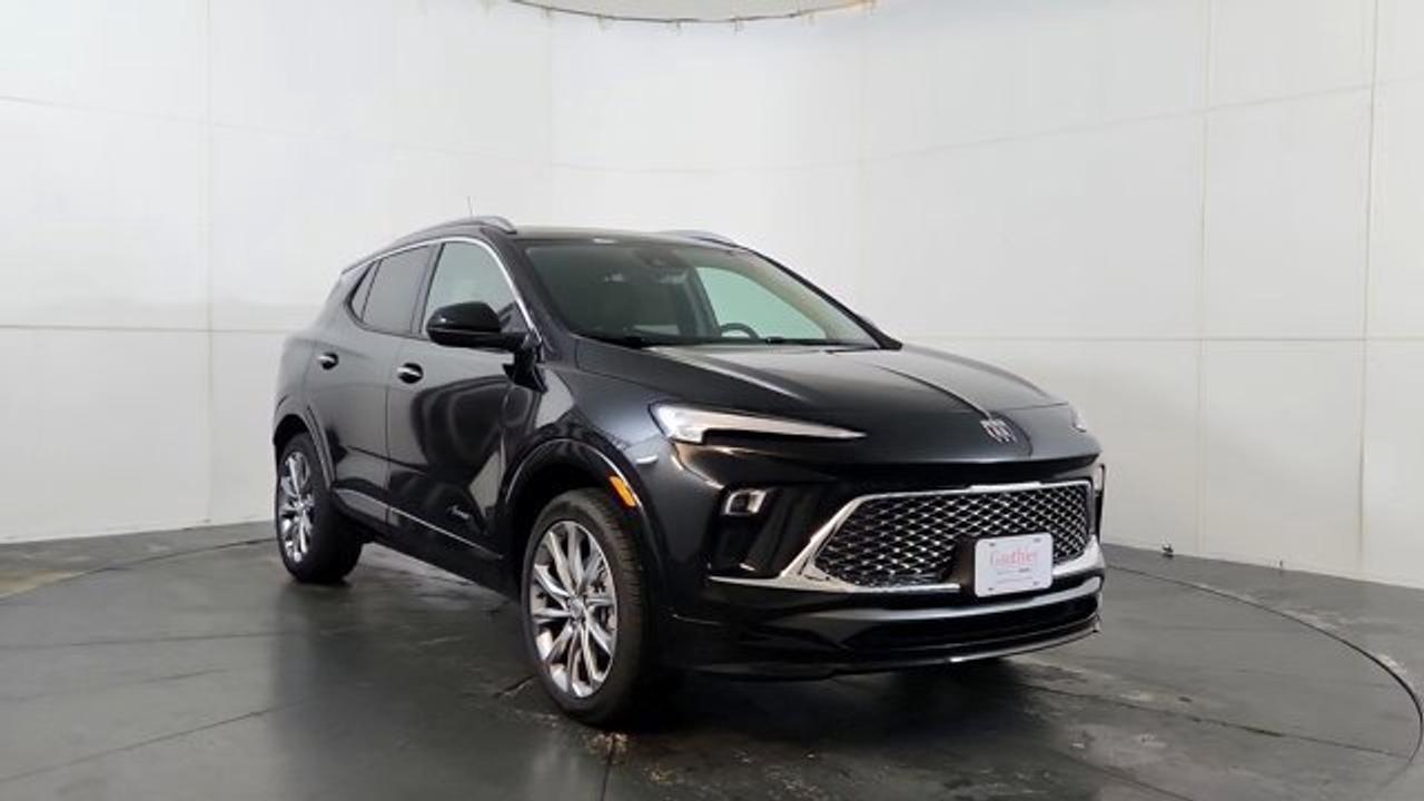 The 2026 Buick Encore GX Avenir elevates Buicks compact SUV to a new level of attainable luxury. Its exterior features distinctive Avenir styling---such as the Black Ice-finish grille, chrome beltline trim, clear-lens LED taillamps, and 19-inch Avenir Pearl Nickel alloy wheels---while the cabin includes perforated leather upholstery, heated power-adjustable front seats with driver memory, a heated steering wheel, a power-folding passenger seatback, auto-dimming rearview mirror, and a 120 V household-style outlet. Technology includes an 11-inch ultrawide touchscreen infotainment system paired with an 8-inch configurable driver display, wireless Apple CarPlay/Android Auto and Wi-Fi hotspot. This model also comes with a power moonroof, Rear Park Assist, HD Surround Vision and wireless charging.
