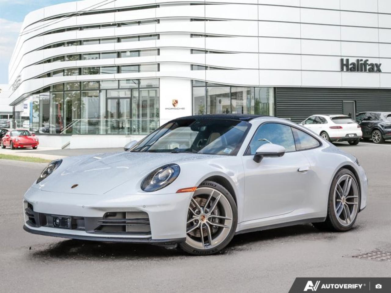 *Now available at Porsche of Halifax*, this *2025 Porsche 911 Carrera* presents a rare opportunity to own a lightly driven *Porsche Canada demo*, offering exceptional value and showroom condition. Finished in classic *White* over a *Black/Limestone Beige Interior with Leather Seats*, it delivers refined comfort, modern technology, and unmistakable Porsche design.*Included with a Porsche CPO Program Vehicle:*  * *2 years of Unlimited-Kilometer Porsche Approved Warranty Coverage, starting either (A) The day after the New Vehicle Limited Warranty expires or (B) The day you take Delivery (if the New Vehicle Limited Warranty is expired)*  * *A 111-Point Inspection performed by Porsche-trained technicians, using only genuine Porsche Parts.*  * *For the duration of the Warranty period, 24-hour Porsche Roadside Assistance, including towing, emergency fuel delivery, lock out service, trip interruption coverage, and more.*==== Comfort & Convenience ====  *   *Adaptive Sport Seats Plus (18-way)* with Memory Package for exceptional long-distance comfort  *   *Ventilated Front Seats* providing year-round luxury  *   *Heated GT Sport Steering Wheel in Leather*  *   *Electric Slide/Tilt Glass Sunroof* enhancing cabin ambiance  *   *Ionizer* and *Premium Interior Finishes* creating a clean, refined environment  *   *Rear Seats* for added versatility==== Technology & Assistance ====  *   *Premium Package* including advanced comfort and convenience features  *   *Adaptive Cruise Control (ACC)* for relaxed highway driving  *   *Surround View with Active Parking Support* for effortless maneuvering  *   *Lane Change Assist (LCA)* providing added awareness and safety  *   *Sport Chrono Package* enhancing drive modes and responsiveness  *   *BOSE® Surround Sound System* delivering crisp, immersive audio==== Exterior & Performance Details ====  *   *20/21 Carrera Exclusive Design Wheels* for an elegant, dynamic stance  *   *Sport Exhaust System with Silver Tailpipes*  *   *Under-Door Puddle Light Projectors*  *   *Model Designation Simplified to 911* for a clean, classic appearance  *   *Extended Range Fuel Tank (22.1 gallons)* for greater convenience between fill-ups----------------------------------------The *2025 911 Carrera* in White offers the perfect blend of modern luxury, everyday comfort, and iconic Porsche performance---enhanced by its status as a *PCL dealer demo*, ensuring excellent condition, low kilometres, and outstanding value. *Now at Porsche of Halifax*---contact us today to schedule your private viewing or test drive.