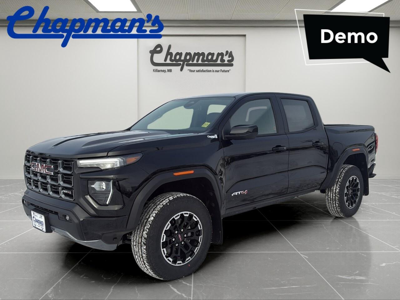 Discover the capability and confidence of this brand new 2026 GMC Canyon AT4 Crew Cab 4WD, now available at Chapman Chevrolet Buick GMC in Killarney. Finished in Black with a Black interior, this midsize truck pairs bold style with practical strength. Its 2.7-litre I4 engine, automatic transmission, and engine block heater make it well suited for Canadian roads and changing seasons.

Built for drivers who want a truck that feels ready for work, travel, and daily life, the 2026 GMC Canyon AT4 Crew Cab 4WD delivers a balanced mix of power, comfort, and modern design. The crew cab layout adds useful passenger room, while the four-wheel-drive system helps support traction when road and weather conditions become more demanding.

FEATURES OF THE Canyon At4 Crew Cab 4wd

»» Black exterior with bold truck presence
»» Black interior with practical cabin layout
»» Automatic transmission for smooth daily driving
»» Engine block heater for cold starts

TRUCK FEATURES

»» Four-wheel drive for added road confidence
»» Crew cab adds passenger-friendly interior space
»» Pickup bed supports work and weekend gear
»» 2.7-litre engine delivers solid truck capability

ADVANCED SAFETY FEATURES

»» GMC safety engineering supports driver awareness
»» Strong truck structure helps protect occupants
»» Four-wheel drive aids traction on surfaces
»» Clear outward visibility supports daily driving

PERFORMANCE AND EFFICIENCY

»» 2.7-litre I4 engine delivers useful power
»» Automatic transmission provides smooth gear changes
»» Balanced performance for highway and city
»» Engine block heater helps winter readiness

COMFORT AND CONVENIENCE

»» Crew cab offers room for passengers
»» Easy cabin access through four doors
»» Black interior creates clean modern look
»» Practical layout supports daily truck use

TECHNOLOGY AND CONNECTIVITY

»» Driver-focused controls are easy to reach
»» Clear instrument display supports quick checks
»» Automatic transmission simplifies everyday operation
»» Modern cabin design feels intuitive and functional

CARGO SPACE

»» Pickup bed handles tools and equipment
»» Open box suits larger bulky items
»» Crew cab keeps cabin space separate
»» Useful truck format supports active lifestyles

WHAT OTHER OWNERS LIKE

»» Strong turbo power for confident driving
»» Crew cab comfort for family use
»» Four-wheel drive for seasonal capability
»» Practical size for work and parking

This new GMC pickup is a smart choice for drivers who need everyday usability with real truck ability. The black-on-black colour combination gives it a clean, confident look, while the automatic transmission helps make every trip easier in town or on the highway.

At Chapman Chevrolet Buick GMC in Killarney, this 2026 GMC Canyon AT4 Crew Cab 4WD stands out as a capable and versatile truck for Canadian drivers. If you want modern GMC strength, useful space, and dependable four-wheel-drive confidence, this brand new model deserves a close look.

This 2026 GMC Canyon At4 Crew Cab 4wds VIN is: 1GTP2DEK2T1154928 .