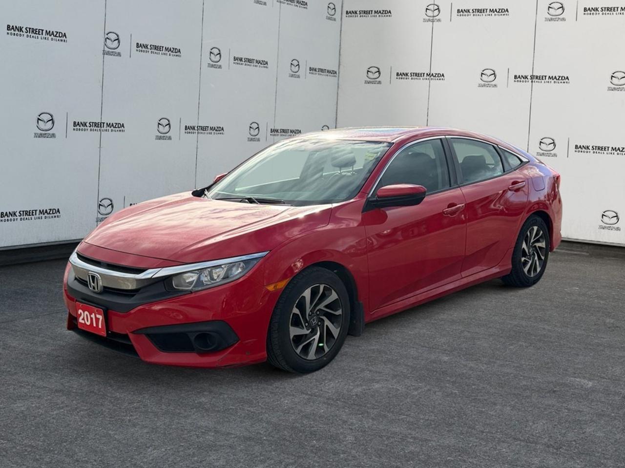 The 2017 Honda Civic Sedan EX in a vibrant red finish brings a spirited and responsive drive with its FWD drivetrain and agile handling. Powered by a 2.0L 4-cylinder engine, this automatic transmission vehicle offers a dynamic driving experience with 158 horsepower at 6500 RPM. This sleek sedan boasts stylish alloy wheels, while the sunroof/moonroof adds a touch of flair and sophistication to its exterior. Inside, enjoy an inviting atmosphere featuring heated front seats and smart device integration for an enhanced driving experience. The cabin offers practicality with features such as keyless entry, power windows, and a user-centric design. The 2017 Honda Civic Sedan EX comes equipped with cutting-edge technology like the backup camera and Bluetooth connection, ensuring enhanced connectivity and convenience. Safety is a priority with adaptive cruise control, brake assist, lane assist, and heated mirrors catering to your peace of mind on every journey. This vehicle is perfect for drivers who seek a combination of comfort and modern conveniences, making it ideal for both commuting and family adventures. Contact us today to find out how this exceptional red Honda Civic Sedan EX can enhance your driving experience.