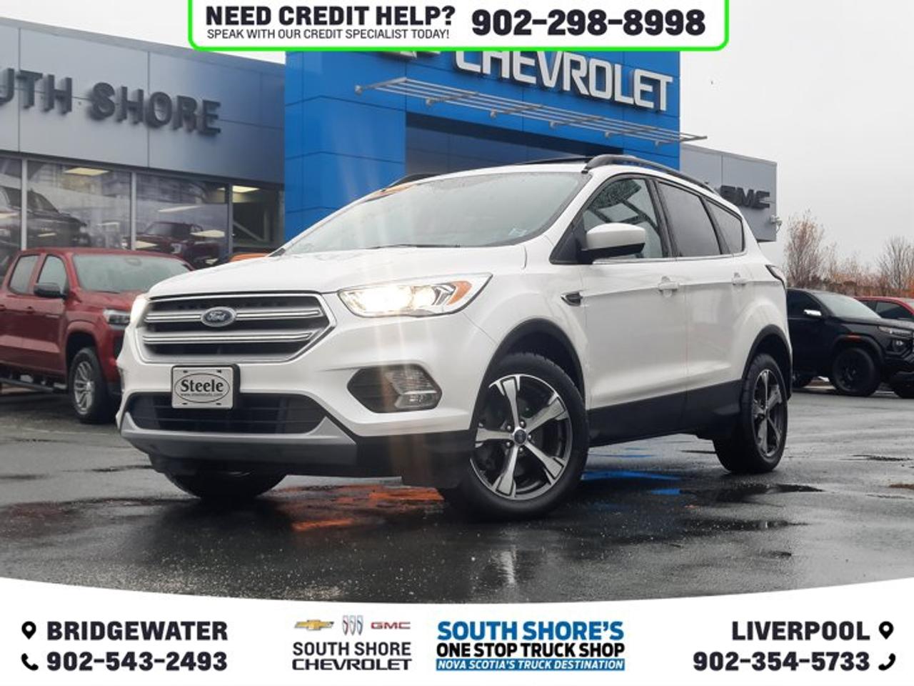 Recent Arrival! Odometer is 25807 kilometers below market average! White Platinum Clearcoat Metallic 2018 Ford Escape SEL For Sale, Bridgewater 4WD 6-Speed Automatic 1.5L EcoBoost 4WD, 6 Speakers, ABS brakes, Air Conditioning, Alloy wheels, Automatic temperature control, Brake assist, Canadian Touring Package, CD player, Compass, Delay-off headlights, Driver door bin, Driver vanity mirror, Dual front side impact airbags, Electronic Stability Control, Exterior Parking Camera Rear, Front anti-roll bar, Front dual zone A/C, Front fog lights, Fully automatic headlights, Heated door mirrors, Heated front seats, Heated Leather Salerno Front Bucket Seats, Knee airbag, Leather Shift Knob, License Plate Bracket, Low tire pressure warning, Navigation System, Occupant sensing airbag, Outside temperature display, Overhead console, Power door mirrors, Power Liftgate, Power Panoramic Vista Roof, Power steering, Power windows, Rear Parking Sensors, Rear window defroster, Remote keyless entry, Speed control, Speed-sensing steering, Split folding rear seat, Tachometer, Tilt steering wheel, Traction control, Trip computer, Variably intermittent wipers. Reviews: * Owners appreciate a modern and unique cabin layout, peace of mind in bad weather, and pleasing performance from the turbocharged engines, particularly the larger 2.0L unit. Controls are said to be easy to use, and interfaces are easily learned. Plenty of at-hand storage is fitted within reach of all occupants to help keep organized and tidy on the move, and the tall and upright driving position helps add confidence. Good brake feel is also noted, particularly during hard stops. Source: autoTRADER.ca