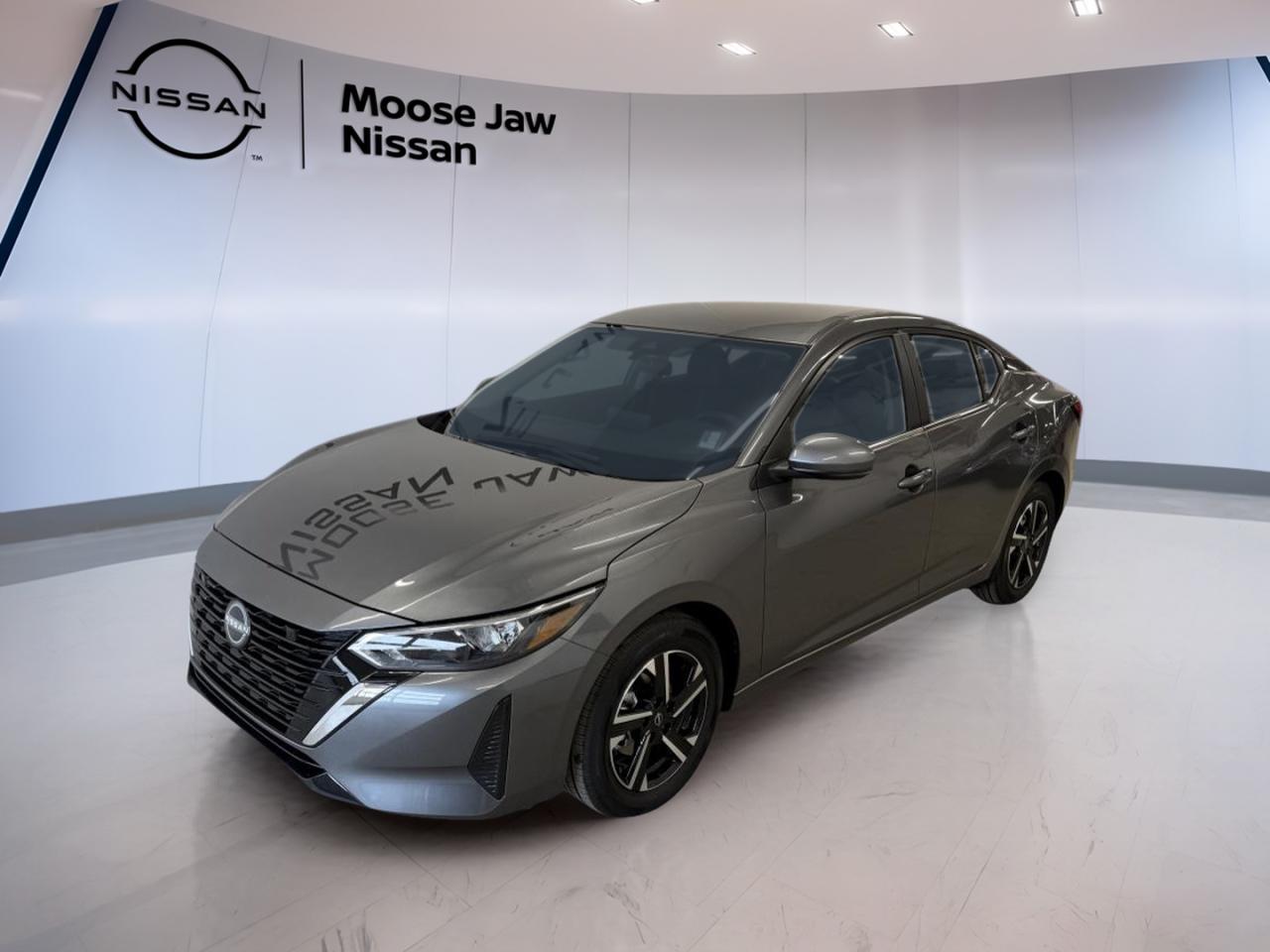 Experience the confidence of driving a brand new 2025 Nissan Sentra SV, now available at Moose Jaw Nissan in Moose Jaw. This sedan stands out with its dark grey exterior and unique blue interior, delivering a modern look that turns heads wherever you go. Powered by a 2.0L DOHC 16V 4-cylinder engine with idle stop/start, it combines efficiency with smooth, responsive performance. The Xtronic Continuously Variable Transmission and front-wheel drive ensure a comfortable ride, making every journey enjoyable.

ADVANCED SAFETY FEATURES  
»» Automatic emergency braking with pedestrian detection  
»» Lane departure warning for added reassurance  
»» Rearview camera for easy parking manoeuvres  
»» Intelligent driver alertness monitoring system  

PERFORMANCE AND EFFICIENCY  
»» 2.0L DOHC 16V 4-cylinder engine  
»» Idle stop/start technology for fuel savings  
»» Xtronic Continuously Variable Transmission  
»» Front-wheel drive for confident handling  

COMFORT AND CONVENIENCE  
»» Dual-zone automatic climate control  
»» Remote engine start system  
»» Heated front seats for cold mornings  
»» 60/40 split fold-down rear seats  

TECHNOLOGY AND CONNECTIVITY  
»» 8-inch touchscreen display  
»» Apple CarPlay and Android Auto integration  
»» Hands-free text messaging assistant  
»» Bluetooth hands-free phone system  

CARGO SPACE  
»» Spacious trunk for daily essentials  
»» Fold-down rear seats for added room  
»» Wide trunk opening for easy loading  
»» Smart storage solutions throughout cabin  

WHAT OTHER OWNERS LIKE  
»» Efficient and reliable daily performance  
»» User-friendly infotainment system  
»» Comfortable ride quality  
»» Modern safety features for peace of mind