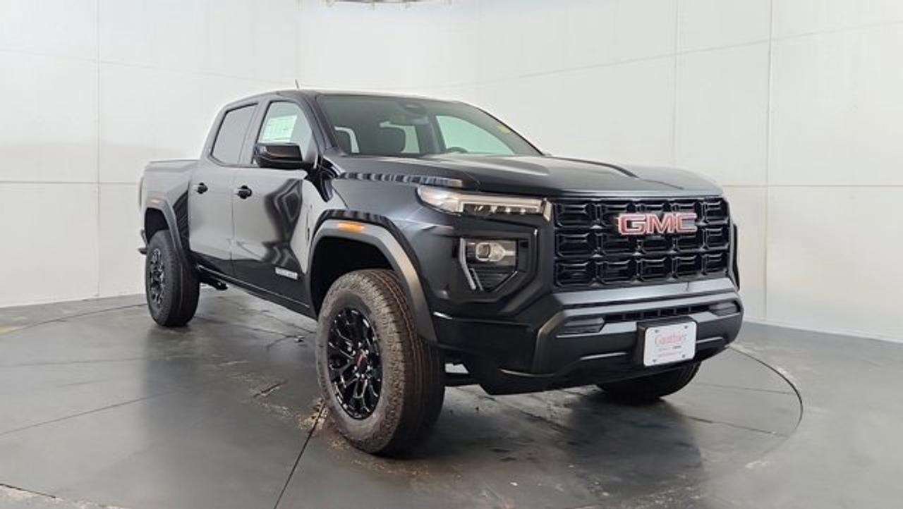 The 2026 GMC Canyon Elevation brings rugged styling and capable performance to the midsize truck segment. Featuring a 310-hp TurboMax 2.7-liter engine, a 2-inch factory lift with a wide track and off-road suspension and a 7,700-lb maximum towing capacity---all standard on this trim. Complementing its capability is a tech-rich interior highlighted by an 11.3-inch center touchscreen, an 11-inch digital driver display, and modern conveniences like wireless Apple CarPlay and Android Auto, along with the ProGrade Trailering System and MultiStow tailgate storage for added versatility. With bold 18-inch gloss-black wheels, all-terrain tires, and 120-volt power outlet, the Elevation strikes a strong balance between on-road comfort and off-road readiness.