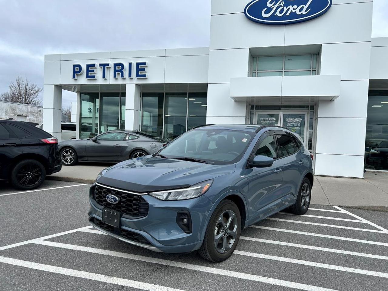 Built Ford tough! Here is a 2023 Ford Escape St-Line Select. Powered by a 2.0L ecoboost engine with an 8-speed automatic transmission that delivers impressive performance and smooth handling. The 2023 Ford Escape St-Line Select features comfortable seating, modern tech features and prioritizes safety. No reported accidents and only one previous owner! Adventure is calling, come check out the 2023 Ford Escape St-Line Select today! Key Features: >> Equipment group 401A >> Sport-tuned suspension >> Remote vehicle start >> Reverse camera system >> Heated steering wheel >> Rear privacy glass >> Roof rails >> Rear spoiler >> Lane keeping system >> Intelligent access >> Illuminated entry >> Safety canopy >> Selectable drive modes >> Tire pressure monitoring system >> Power folding and heated mirrors >> FORDPASS CONNECT and so much more! This 2023 Ford Escape St-Line Select is available now at Petrie Ford. We are located at 1388 Bath Road in Kingston, Ontario. Come schedule a test drive today!<p>Built Ford tough! Here is a 2023 Ford Escape St-Line Select. Powered by a 2.0L ecoboost engine with an 8-speed automatic transmission that delivers impressive performance and smooth handling. The 2023 Ford Escape St-Line Select features comfortable seating</p>
<p> modern tech features and prioritizes safety. No reported accidents and only one previous owner! Adventure is calling</p>
<p> come check out the 2023 Ford Escape St-Line Select today! Key Features: >> Equipment group 401A >> Sport-tuned suspension >> Remote vehicle start >> Reverse camera system >> Heated steering wheel >> Rear privacy glass >> Roof rails >> Rear spoiler >> Lane keeping system >> Intelligent access >> Illuminated entry >> Safety canopy >> Selectable drive modes >> Tire pressure monitoring system >> Power folding and heated mirrors >> FORDPASS CONNECT and so much more! This 2023 Ford Escape St-Line Select is available now at Petrie Ford. We are located at 1388 Bath Road in Kingston</p>
