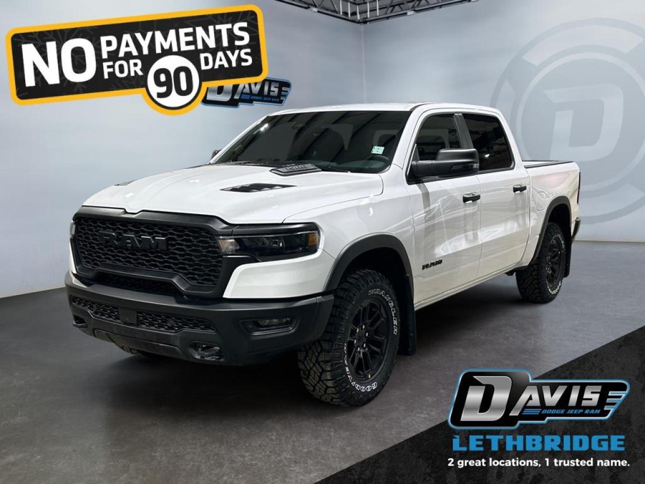 <b>E- Locker, Navigation, Apple CarPlay, Android Auto, Blind Spot Monitoring!<br /> <br /></b><br /> <br /> <br />The 2026 Ram 1500 Rebel in Bright White Clear Coat is built for off-road performance and bold style. Powered by a 3.0L I6 Twin-Turbo Hurricane engine with 8-speed automatic transmission and 4x4 drivetrain, it features off-road tuned shocks, E-Locker rear axle, 18-inch black wheels with all-terrain tires, dual black exhaust tips, and LED lighting for rugged capability.<br /><br />Inside, enjoy cloth/vinyl Rebel bucket seats, heated front seats, dual-zone climate control, 12-inch Uconnect touchscreen, Apple CarPlay/Android Auto, premium 9-speaker audio, and full-length upgraded floor console. Functional upgrades include under-seat storage, pickup box, capless fuel fill, and class IV receiver hitch.<br /><br />Safety and driver-assist tech include Adaptive Cruise Control with Stop & Go, Full-Speed Forward Collision Warning, Active Lane Management, Blind Spot & Cross Path Detection, ParkView rear camera, and Pedestrian Emergency Braking. The Ram 1500 Rebel blends off-road readiness, comfort, and advanced technology for adventure-seeking drivers.<br /> <br />To apply right now for financing use this link: <a href=https://www.bridgecitychrysler.com/pre-approval/ target=_blank rel=nofollow noopener noreferrer>https://www.bridgecitychrysler.com/pre-approval/</a><br /><br /> <br /><br />As a premier Chrysler, Dodge, Jeep and RAM dealership, Bridge City Chrysler proudly offers an extensive selection of new and used vehicles to meet every drivers needs. Customers across Lethbridge, Fort Macleod, Taber, Claresholm, Coaldale, and beyond trust us for daily vehicle specials, certified service and parts, and a seamless online inventory experience. <br /><br /> With competitive financing options and expert support, we make car buying easy and enjoyable. <br /><br /> Ready to hit the road? Schedule your test drive today at Bridge City Chrysler, your trusted Chrysler, Dodge, Jeep and RAM dealer in Lethbridge, Alberta.<br /><br /> Vehicle pricing offer shown expires 2026-01-31. <br /> Come by and check out our fleet of 80+ used cars and trucks and 120+ new cars and trucks for sale in Lethbridge. o~o