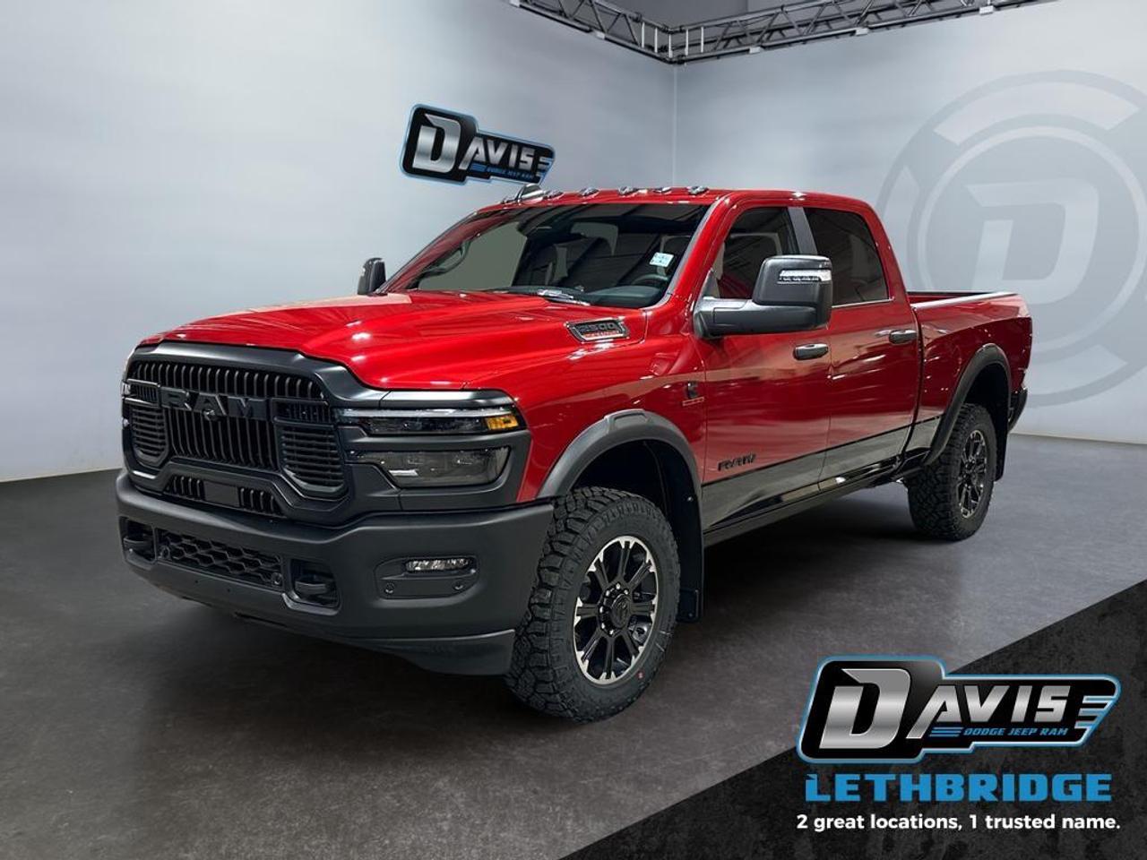 <b>Navigation, Heated Seats, Blind Spot Detection, Remote Start, Heated Steering Wheel!<br /> <br /></b><br /> <br /> <br />Take on any job or trail with the 2026 Ram 2500 Rebel Crew Cab in Molten Red Pearl with a two-tone lower accent. Built for power and durability, it features a 6.7L Cummins Turbo Diesel I6 engine, 8-speed TorqueFlite HD automatic transmission, and 4x4 drivetrain for maximum towing, payload, and off-road capability.<br /><br />This Rebel comes equipped with the Rebel Performance Suspension, 20 Black Diamond-Cut aluminum wheels, LT285/60R20 all-terrain tires, powder-coated front and rear bumpers, LED lighting, and a MOPAR spray-in bedliner. Inside, enjoy heated 40/20/40 cloth power bench seats, rear 60/40 fold-flat seating, Uconnect 5 NAV with 12 touchscreen, Apple CarPlay, Android Auto, Alexa built-in, and a 6-speaker audio system.<br /><br />Safety and convenience are top-notch with adaptive cruise control with stop, ParkView rear camera, ParkSense front/rear park assist, blind-spot monitoring with cross-path detection, Class V hitch, tow hooks, trailer sway damping, and tip start. Rugged, capable, and tech-savvy, the 2026 Ram 2500 Rebel is ready for work, adventure, and everything in between.<br /> <br />To apply right now for financing use this link: <a href=https://lethbridge.davisdodge.ca/free-credit-check/ target=_blank rel=nofollow noopener noreferrer>https://lethbridge.davisdodge.ca/free-credit-check/</a><br /><br /> <br /><br />As a premier Chrysler, Dodge, Jeep and RAM dealership, Davis Dodge proudly offers an extensive selection of new and used vehicles to meet every drivers needs. Customers across Lethbridge, Fort Macleod, Taber, Claresholm, Coaldale, and beyond trust us for daily vehicle specials, certified service and parts, and a seamless online inventory experience. <br /><br /> With competitive financing options and expert support, we make car buying easy and enjoyable. <br /><br /> Ready to hit the road? Schedule your test drive today at Davis Dodge, your trusted Chrysler, Dodge, Jeep and RAM dealer in Lethbridge, Alberta.<br /><br /> Vehicle pricing offer shown expires 2026-04-30. <br /> Come by and check out our fleet of 60+ used cars and trucks and 110+ new cars and trucks for sale in Lethbridge. o~o