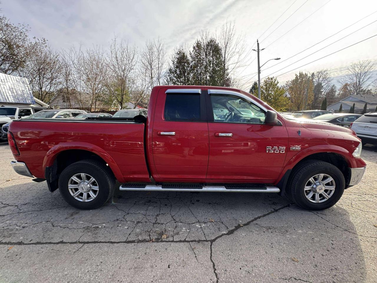 2013 RAM 1500 4WD Quad Cab 140.5" Outdoorsman Photo2