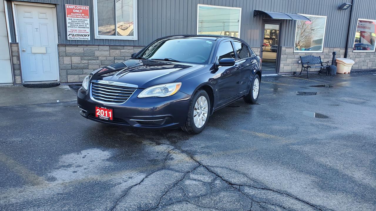 <p>JUST IN.</p><p>Looking for a reliable and stylish sedan? Check out this eye-catching blue 2011 Chrysler 200 4dr Sdn LX, available now at Fusion Auto Sales! This sleek sedan offers a comfortable black interior, perfect for both daily commutes and weekend getaways. With a fuel-efficient 2.4L V4 engine and smooth automatic transmission, youll enjoy a responsive and enjoyable driving experience. This Chrysler 200 is ready for the road, and has 178,403km on the odometer.</p><p>This 2011 Chrysler 200 is packed with features designed to enhance your driving experience. The sedan has a practical front-wheel drive, providing confident handling in various road conditions. You can also expect a comfortable ride thanks to its well-designed suspension. The Chrysler 200 offers a great balance of practicality and style.</p><p>Here are five features that make this 2011 Chrysler 200 stand out:</p><ul><li><strong>Fuel-Efficient Engine:</strong> The 2.4L V4 engine provides excellent fuel economy, saving you money at the pump.</li><li><strong>Automatic Transmission:</strong> Enjoy effortless driving with a smooth-shifting automatic transmission.</li><li><strong>Spacious Interior:</strong> The four-door sedan configuration provides ample space for passengers and cargo.</li><li><strong>Stylish Design:</strong> The Chrysler 200 boasts a timeless design that will turn heads wherever you go.</li><li><strong>Reliable Performance:</strong> Known for its dependability, this Chrysler 200 is built to last.</li></ul><p><strong><em>Powered by AutoIntelligence&trade;</em></strong> Vehicle information has been generated using artificial intelligence and is provided for informational purposes only. While efforts are made to ensure accuracy, please confirm all details directly with the dealer.</p><p>The Fusion Philosophy<br><br>At Fusion Auto Sales, we put more effort into buying our vehicles than we do trying to sell them. By constantly monitoring what other car lots are doing, we strive to be the lowest priced dealer in our market. We won&rsquo;t purchase a vehicle to &ldquo;fill a hole&rdquo;. We know that the vehicles on our lot are great value for the money and smart shoppers realize that also. Adhering to this philosophy makes it easy for our customers. If they find a vehicle on our lot that fulfills their needs and wants, they know that they&rsquo;re getting great value. <br><br>If we don&rsquo;t have what you&rsquo;re looking for, we can find it! Over 150 customers have saved thousands of dollars buy joining our&rdquo; locate club&rdquo;. People that know what they want and what they want to pay (within reason of course), get the vehicle of their dreams and enjoy huge savings. Contact us for details.<br><br><br><br>Fusion Auto Sales is in Tilbury, Ont. located between Windsor and London right off the 401. We are among 7 dealerships within a &frac12; kilometer distance which is great for out of town shoppers. We began satisfying customers in 2009 and have been doing so ever since. In 2012 Fusion was recognized as 1 of the 50 fastest growing companies in Canada. And then, in 2018, we were named one of the top 5 independent automobile dealerships in the country. <br><br>We specialize in late model vehicles at below than average pricing, everything is fully certified and every unit is Car Proof verified and is fully disclosed with every unit. We offer every type of financing from perfect credit at great rates to credit challenges with competitive rates. We also specialize in locating vehicles for customers, we cant have everything on the lot so if you do not see it and are having a hard time finding what you are looking for, let us know and we can find it for you. Fusion Auto Sales spans its customer base from Windsor all the way to Timmins, On and every where in between. Our philosophy is You are going to like the way we deal and everyone does, straight honest answers with no monkey business and no back and forth between sales and managers.</p>