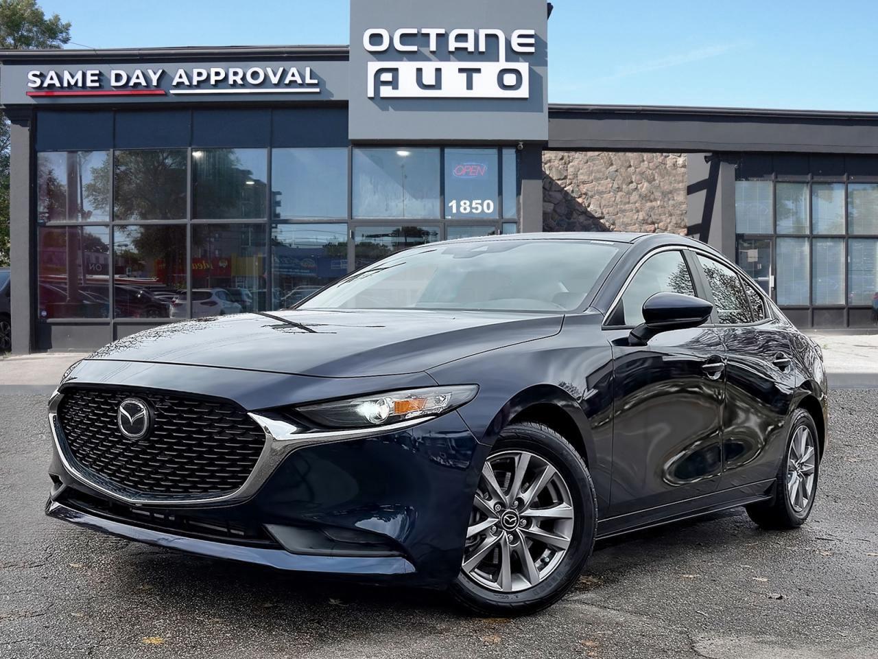 <p>Finance Price $21,895 Cash Price $23,395<br><br>2021 Mazda Mazda3 GS AWD is a stylish and well balanced compact car that delivers sporty handling, all weather capability, and premium comfort. Powered by a 2.5L 4 cylinder engine paired with a smooth automatic transmission and Mazda&rsquo;s i-ACTIV all wheel drive system, it offers strong performance and confident traction in all conditions.<br><br>The GS trim includes heated front seats, heated steering wheel, dual zone climate control, keyless entry with push button start, rearview camera, and the Mazda Connect infotainment system with Apple CarPlay, Android Auto, Bluetooth, and USB connectivity.<br><br>With its upscale interior, advanced safety features, and refined driving dynamics, the 2021 Mazda3 GS AWD is an excellent choice for drivers who value comfort, reliability, and performance.<br><br>Available Now at Octane Used Cars<br>1850 Lawrence Ave E, Scarborough, ON M1R 2Y4<br>Call us today to book your test drive.<br><br>CERTIFICATION<br>All our vehicles go through a comprehensive safety inspection that exceeds industry standards. Certification includes a full inspection, oil change, and professional detailing before delivery. Vehicles are not drivable if not certified and not e-tested. A certification package is available for $699. Trade-ins welcome. All vehicles are subject to HST, licensing fees, and a $22 OMVIC fee.<br><br>FINANCING<br>Good credit, bad credit, or no credit, we can help. Whether you are new to Canada or dealing with bankruptcy, consumer proposal, or collections, our finance team can help you get approved and back on the road quickly. Instant approvals are available with flexible financing options tailored to your needs. Financing deals are subject to an admin fee.<br><br>WARRANTY<br>This Mazda3 GS AWD qualifies for extended warranty options with multiple terms and coverage levels available. Our team can help you choose the protection plan that best fits your needs.<br><br>PRICE<br>At Octane Used Cars, we believe in fair, transparent, no haggle pricing. We constantly monitor the market to keep our vehicles priced below average, saving you time and money. Skip the stress of negotiating and get the best deal upfront with a no pressure buying experience.</p>