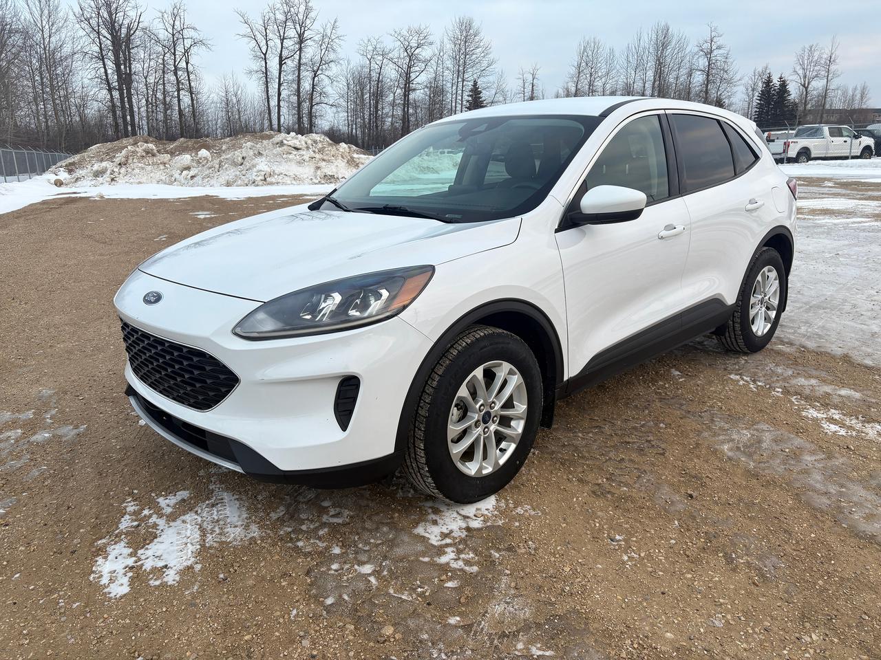 <p data-start=85 data-end=123><strong data-start=85 data-end=123>2020 Ford Escape SE &ndash; Oxford White</strong></p><p data-start=125 data-end=778>The 2020 Ford Escape SE in Oxford White delivers a clean, modern look with practical design and everyday versatility. Exterior highlights include a black grille with chrome surround, LED brake lights, lip spoiler, body-coloured front bumper, black rear bumper with metal-look accents, chrome side window trim, black bodyside cladding, and 17 shadow silver-painted aluminum wheels. Additional features such as perimeter/approach lighting, speed-sensitive intermittent wipers, automatic halogen projector headlamps with auto high-beams, heated rear window with wiper and defroster, and a rear liftgate with cargo access add convenience and functionality.</p><p data-start=780 data-end=1276>Inside, the Escape SE offers a comfortable and well-appointed cabin with heated unique cloth bucket seats, an 8-way power driver&rsquo;s seat, full cloth headliner, automatic air conditioning, tilt-and-telescoping steering wheel, cruise control with steering-wheel controls, and a full floor console with covered storage. Interior storage is generous with door bins, concealed cargo storage, front and rear cupholders, rear seat armrest, and a 60/40 split-folding rear seat for added cargo flexibility.</p><p data-start=1278 data-end=1850>Technology features include FordPass Connect with 4G mobile hotspot capability, Bluetooth&reg; connectivity, streaming audio, a driver information centre, keypad entry, MyKey&reg; system, and a 6-speaker audio system. Safety is a priority with Ford Co-Pilot360&trade;, including a rear-view camera, automatic emergency braking, Blind Spot Information System (BLIS), cross-traffic alert, driver monitoring alert, and collision mitigation. Additional safety features include Safety Canopy&reg; airbags, tire pressure monitoring system, child safety locks, and SecuriLock&reg; anti-theft ignition.</p><p data-start=1852 data-end=2079>Power comes from a fuel-efficient 1.5L EcoBoost&reg; engine paired with an 8-speed automatic transmission and start-stop technology, delivering a smooth and responsive driving experience ideal for city commuting and highway travel.</p>