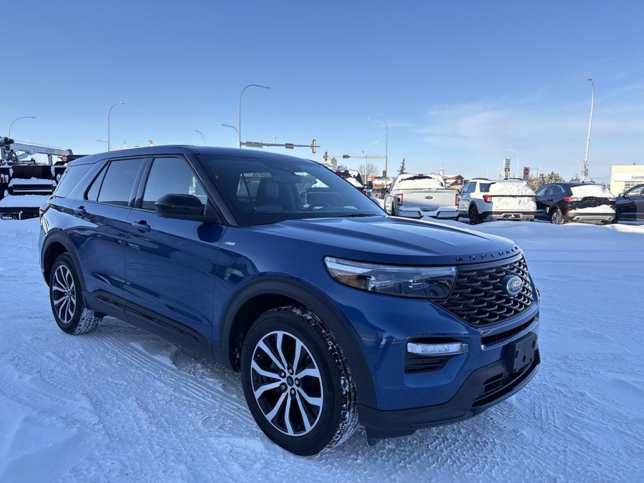 THE PRICE YOU SEE, PLUS GST. GUARANTEED!APPLE CARPLAY/ANDROID AUTO COMPATABLE! 2.3 LITER ECOBOOST I-4, 10 SPEED AUTO, ST-LINE TRIM(250a), ACTIVE -X SEATING, TWIN PANEL MOONROOF, 20 MACHINED ALUMINUM WHEELS, HEATED FRONT SEATS, ADAPTIVE CRUISE.      The 2022 Ford Explorer ST-Line with the 2.3-liter EcoBoost four-cylinder engine and the 250A package is a stylish and sporty midsize SUV that offers a blend of performance, comfort, and advanced features. The 2.3-liter turbocharged EcoBoost engine produces around 300 horsepower and 310 lb-ft of torque, providing spirited driving dynamics and good fuel efficiency for its class. Paired with a 10-speed automatic transmission, the powertrain delivers smooth acceleration and confident handling. The ST-Line trim emphasizes a sportier appearance with unique styling cues such as a blacked-out grille, sporty exterior accents, and 20-inch wheels, giving it a more aggressive look. The 250A package enhances the vehicles interior with premium amenities, including leather-trimmed seats, a panoramic sunroof, and a user-friendly SYNC 4 infotainment system featuring a large touchscreen, Apple CarPlay, and Android Auto compatibility. Additional features include advanced safety and driver-assistance technologies like blind-spot monitoring, rear cross-traffic alert, and adaptive cruise control, making the Explorer a well-rounded SUV for families or adventure seekers. Overall, the 2022 Ford Explorer ST-Line with the 2.3L engine and 250A package offers a compelling combination of sporty styling, modern technology, and practical versatility.Do you want to know more about this vehicle, CALL, CLICK OR COME ON IN!*AMVIC Licensed Dealer; CarFax and Full Mechanical Inspection Included.