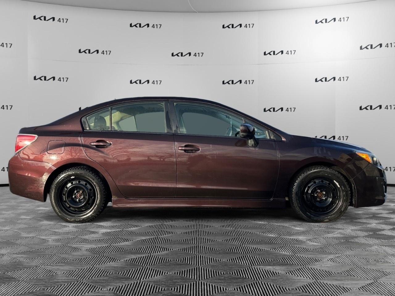 2013 Subaru Impreza 4dr Sdn CVT 2.0i w/Touring Pkg Photo