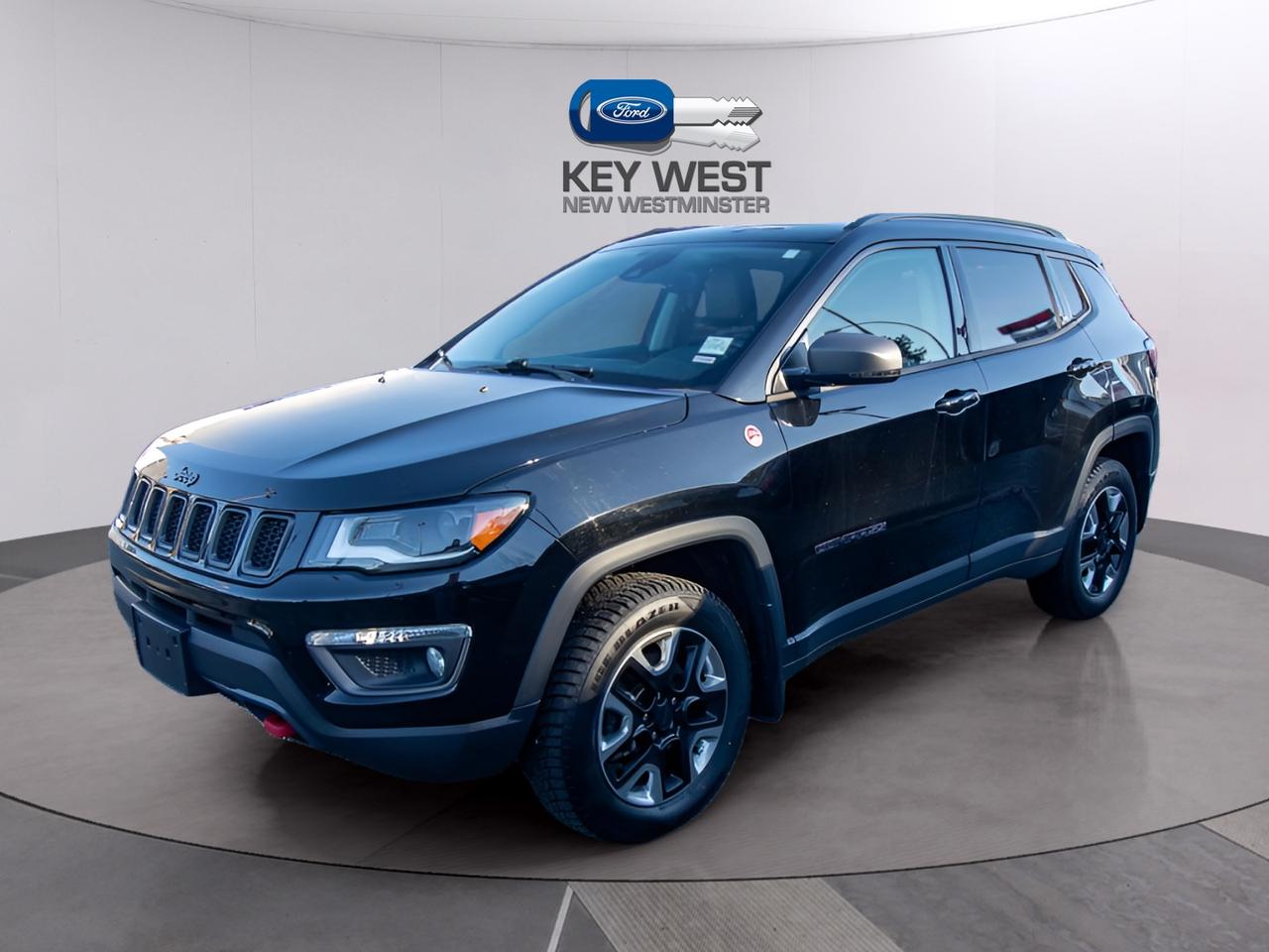 <p>Looking for adventure without sacrificing everyday practicality? This rugged 2018 Jeep Compass Trailhawk 4x4, available now at Key West Ford, is ready to take you there. This striking black SUV boasts the Trailhawk trim, meaning its built to tackle tough terrain. With its capable 4-wheel drive system and automatic transmission, the Compass Trailhawk is prepared for whatever the Canadian landscape throws your way. The odometer reads 137,316km, suggesting its been well-loved and is ready for its next journey.</p><p>This Jeep Compass Trailhawk offers a comfortable and versatile interior, perfect for both daily commutes and weekend getaways. With four doors, this SUV is designed to accommodate passengers and cargo with ease, making it a great choice for families or anyone who enjoys an active lifestyle. Its fuel-efficient gasoline engine ensures you can explore further without breaking the bank at the pump. Dont miss the opportunity to own a capable and stylish SUV. Visit Key West Ford today to experience the Jeep Compass Trailhawk firsthand!</p><p>Here are five features that make this Jeep Compass Trailhawk a standout:</p><ul><li><strong>Trail Rated Capability:</strong> Conquer off-road adventures with the Trailhawks legendary 4x4 system, ready for mud, rocks, and everything in between.</li><li><strong>Distinctive Style:</strong> Turn heads with the rugged and stylish design, making a bold statement wherever you go.</li><li><strong>Comfortable Interior:</strong> Enjoy a well-appointed cabin designed for both driver and passenger comfort on any journey.</li><li><strong>Automatic Transmission:</strong> Experience effortless driving with the smooth-shifting automatic transmission.</li><li><strong>Fuel-Efficient Engine:</strong> Go further with the fuel-efficient engine, maximizing your adventures.</li></ul><p><strong><em>Powered by AutoIntelligence&trade;</em></strong> Vehicle information has been generated using artificial intelligence and is provided for informational purposes only. While efforts are made to ensure accuracy, please confirm all details directly with the dealer.</p><p>Experience peace of mind with our Buy With Confidence program! This vehicle comes with a comprehensive mechanical and safety inspection, Carfax report, and full disclosure. We are committed to transparent pricing. The advertised price excludes fees: $699 Documentation, $349 Registration/Insurance Transfer, $695 Finance Administration Fee (if applicable), and taxes. As BCs #1 Volume Dealer and #1 for Customer Experience on DealerRater, we prioritize your satisfaction. See Key West Ford for complete details. Book your test drive today!&nbsp; Dealer #7485</p>