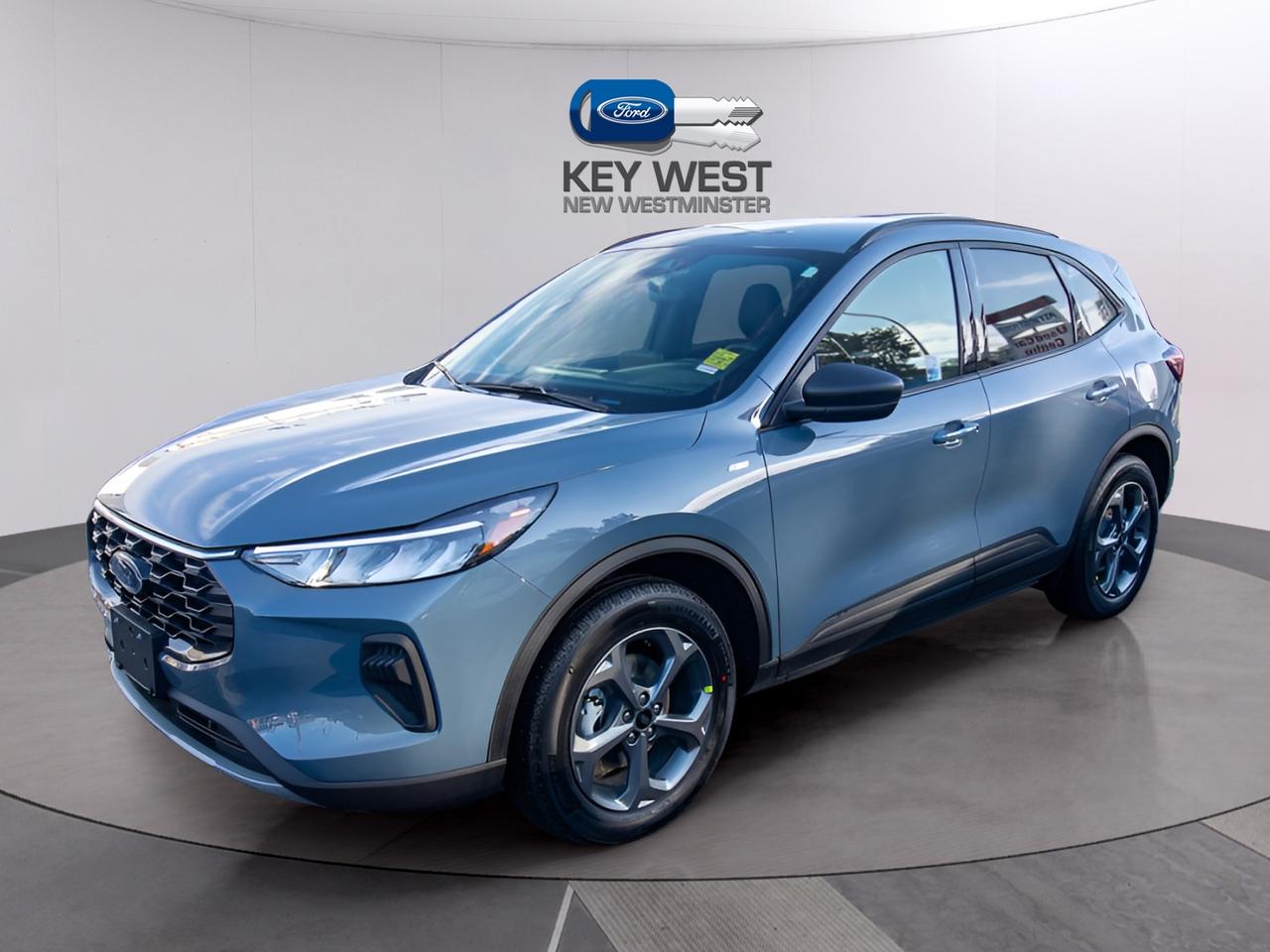 <p>Looking for a stylish and efficient SUV thats ready for anything? Check out the new 2026 Ford Escape ST-Line AWD HYBRID, now available at Key West Ford! This sleek SUV, painted in a head-turning Vapor Blue Metallic, combines sporty design with impressive fuel economy thanks to its hybrid powertrain. Whether youre navigating city streets or exploring the open road, the Escape ST-Line AWD HYBRID offers a comfortable and capable driving experience. With its modern features and all-wheel drive, youll be prepared for whatever the Canadian weather throws your way.</p><p>&nbsp;</p><p>This Escape is packed with features designed to enhance your driving experience. The ST-Line trim adds a touch of sporty flair, while the hybrid engine ensures youre saving money at the pump. Inside, youll find a well-appointed cabin with comfortable seating and convenient technology. The Escape ST-Line AWD HYBRID is the perfect blend of practicality, style, and efficiency.</p><p>&nbsp;</p><p>Here are five standout features of this impressive vehicle:</p><p><br><br></p><ul><li><strong>All-Wheel Drive:</strong> Conquer any road condition with confidence, thanks to the advanced all-wheel-drive system.</li></ul><p>&nbsp;</p><ul><li><strong>Hybrid Powertrain:</strong> Experience impressive fuel efficiency, saving you money and reducing your environmental impact.</li></ul><p>&nbsp;</p><ul><li><strong>Heated Steering Wheel:</strong> Stay comfortable on those chilly Canadian mornings with a heated steering wheel.</li></ul><p>&nbsp;</p><ul><li><strong>Blind Spot Information System (BLIS):</strong> Drive with added confidence, knowing BLIS is watching your blind spots.</li></ul><p>&nbsp;</p><ul><li><strong>Remote Start System:</strong> Warm up or cool down your vehicle before you even get inside.</li></ul><p><br><br></p><p><strong><em>Powered by AutoIntelligence&trade;</em></strong><br>Vehicle information has been generated using artificial intelligence and is provided for informational purposes only. While efforts are made to ensure accuracy, please confirm all details directly with the dealer.</p><p>&nbsp;</p><p>Advertised pricing is net of applicable Ford incentives, which eligibility may vary. Financing offers are available on approved credit; total cash back amounts will be added to the finance contract. Pricing may include non-combinable offers and may not be compatible with Ford subvented interest rates. Government rebates are taxable and applied as a post-tax down payment, not as a discount on the vehicles price. All promotions are subject to terms and conditions. New vehicle pricing excludes the following fees: $699 Documentation Fee, $349 Registration and Insurance Transfer Fee, and $695 Finance Administration Fee (if financing) and applicable levies and taxes. See Key West Ford for complete details. Dealer #7485</p>