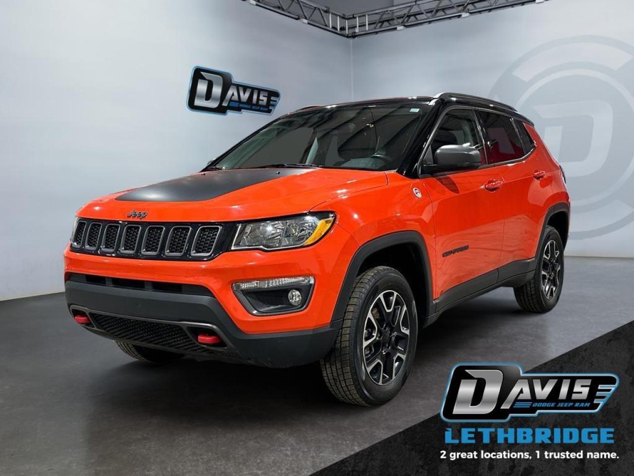 <b>Trail Rated 4x4 - Remote Start - Heated Seats & Steering Wheel - Blind Spot Monitoring - Apple Car Play/Android Auto<br /><br /> <br /></b><br /> For an adventurous compact SUV that can double as a family car, look no further than this Jeep Compass. This 2021 Jeep Compass is for sale today in Lethbridge. <br /> <br />From the first look inside this amazing SUV, you'll know that you're surrounded in greatness. With stunning interior and exterior finishes plus a convenient driver experience, this Jeep Compass is ready to tackle whatever you put in front of it. This amazing SUV combines modern safety, next gen technology, and rugged capability into an attractive package. This SUV has 85,277 km. Stock number 40855 is Red in colour. It has an Automatic transmission and is powered by a 180HP 2.4L 4 Cylinder Engine. It may have some remaining factory warranty, please check with dealer for details. <br /> <br /> Our Compass's trim level is Trailhawk. This Compass Trailhawk is ready for your next off road adventure with added off road suspension, skid plates, tow hooks, easy clean flooring, and blind spot monitoring with rear cross path detection. Stay connected on your daily commute or next adventure with Jeeps Uconnect 4 with Apple CarPlay, Android Auto, and wireless connectivity. This family crossover lets you cruise in style and comfort with chrome accents, heated seats, a heated leather steering wheel, ambient interior lighting, a proximity key, remote start, cornering lamps, fog lamps, rear park assist, and ParkView Rear Backup Camera. This vehicle has been upgraded with the following features: Off-Road Suspension, Remote Start, Wireless Connectivity, Heated Seats, Apple CarPlay, Android Auto, Proximity Key.<br /> <br />To apply right now for financing use this link: <a href=https://www.bridgecitychrysler.com/pre-approval/ target=_blank rel=nofollow noopener noreferrer>https://www.bridgecitychrysler.com/pre-approval/</a><br /><br /> <br /><br />Locally Owned & Trusted for Over 35 Years  Bridge City Chrysler in Lethbridge, AB <br /><br /> At Bridge City Chrysler, weve proudly served the Lethbridge community for more than 35 years, offering an unparalleled car buying experience. Dont just take our word for itour Google reviews speak volumes about our commitment to exceptional service. <br /><br /> Delivery & At-Home Test Drives: Convenient options to suit your lifestyle. <br /><br /> Flexible Financing for Everyone: Get the vehicle you need with financing solutions tailored to your situation. <br /><br /> Full Mechanical Inspections & Professional Cleaning: Every vehicle is thoroughly inspected and cleaned before it hits our lot.<br /><br /> We take all makes and models on trade and offer competitive pricing with inventory that changes daily. Whether you're shopping for a Chrysler, Dodge, Jeep, RAM, or FIAT, our AMVIC Licensed dealership makes it easy to browse, buy, and drive away.<br /><br /> Located in Lethbridge, AB, we proudly serve customers in Fort Macleod, Taber, Claresholm, and Coaldale. Shop online or visit us today to experience the best in sales, service, and selection. Standard bank rates apply; taxes are additional.<br /><br /> Vehicle pricing offer shown expires 2026-01-31. <br /> Come by and check out our fleet of 80+ used cars and trucks and 130+ new cars and trucks for sale in Lethbridge. o~o