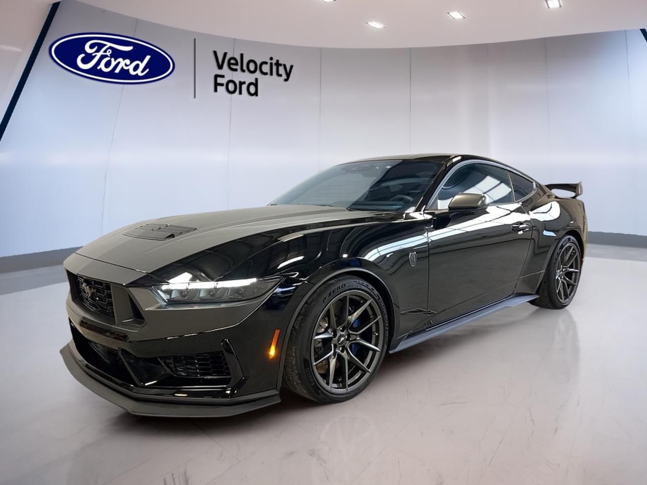 Experience the thrill of pure performance with the brand new 2025 Ford Mustang Dark Horse, now available at Velocity Ford in Moose Jaw. This iconic coupe stands out with its bold black exterior and matching black interior, delivering a striking presence on the road. Engineered for enthusiasts, it features a TREMEC 6-speed manual transmission and rear-wheel drive, ensuring an authentic, engaging drive every time.

FEATURES OF THE Mustang Dark Horse  
»» TREMEC 6-speed manual transmission for precise shifting  
»» MOD 5.0L-4V DOHC EFI naturally aspirated engine  
»» Distinctive black exterior and black interior design  
»» Rear-wheel drive for classic Mustang handling  

ADVANCED SAFETY FEATURES  
»» Side impact airbags for added occupant protection  
»» Rearview camera for easier parking and reversing  
»» Traction control system for stable driving  
»» Electronic stability control for confident handling  

PERFORMANCE AND EFFICIENCY  
»» MOD 5.0L-4V DOHC EFI V8 engine  
»» Naturally aspirated for instant throttle response  
»» TREMEC 6-speed manual for driver engagement  
»» Rear-wheel drive for optimal performance balance  

COMFORT AND CONVENIENCE  
»» Dual-zone automatic climate control for personalized comfort  
»» Power-adjustable driver?s seat for tailored support  
»» Push-button start for quick getaways  
»» Spacious front seating for a relaxed ride  

TECHNOLOGY AND CONNECTIVITY  
»» Touchscreen infotainment system with intuitive controls  
»» Bluetooth connectivity for hands-free calls and music  
»» USB ports for device charging and integration  
»» Premium sound system for immersive audio  

CARGO SPACE  
»» Ample trunk space for weekend getaways  
»» Split-folding rear seats for added flexibility  
»» Wide trunk opening for easy loading  
»» Practical interior storage compartments  

WHAT OTHER OWNERS LIKE  
»» Powerful V8 engine delivers exhilarating performance  
»» Engaging manual transmission enhances driving experience  
»» Striking exterior design commands attention  
»» Advanced technology features for modern connectivity  

This 2025 Ford Mustang Dark Horses VIN is: 1FA6P8R07S5502717.