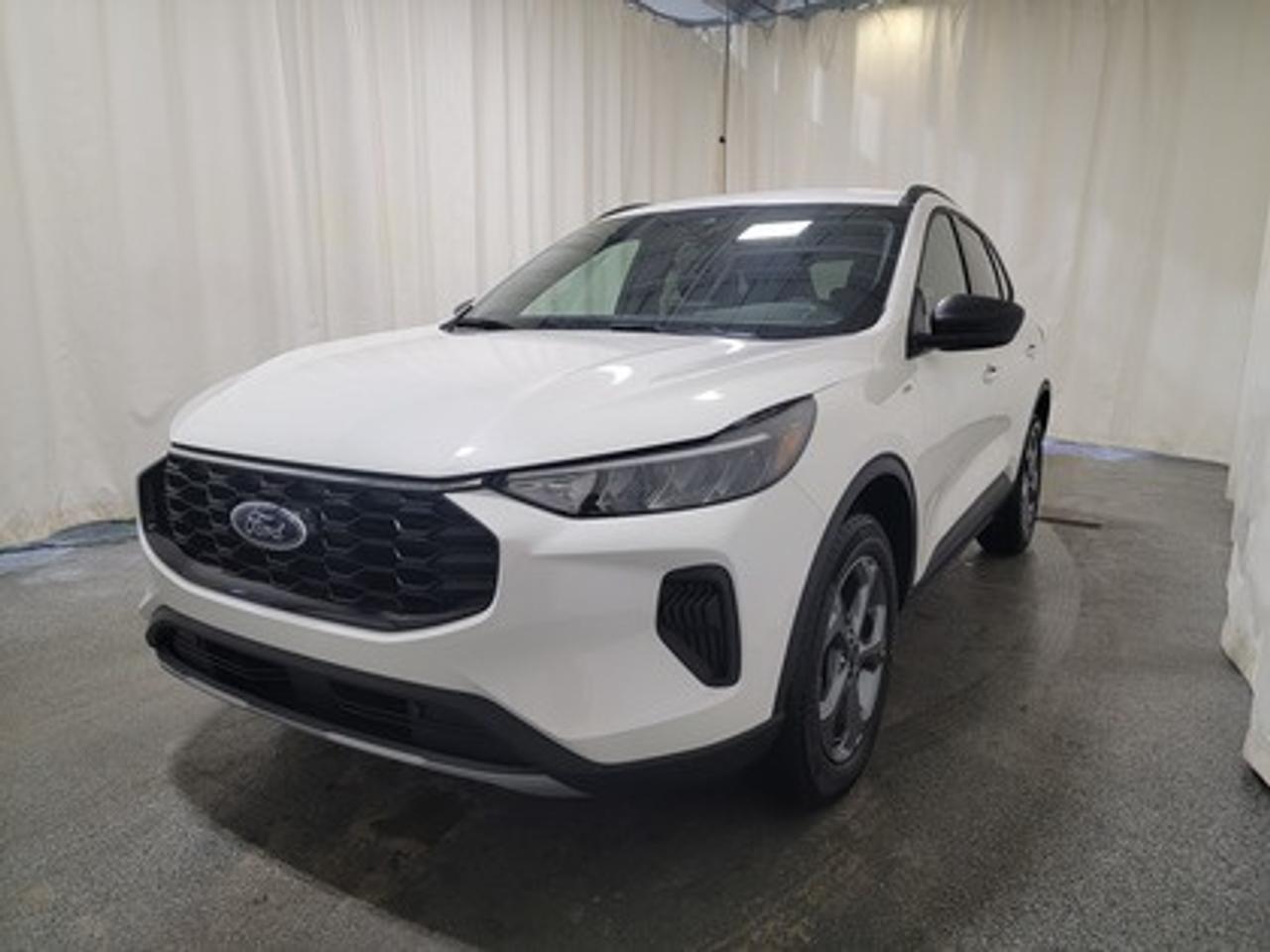 This all-new 2026 Escape ST-Line 300A looks absolutely stunning in Star White Metallic Tri-Coat. This 5-passenger all-wheel drive crossover is equipped with the 1.5L EcoBoost® engine. This remarkable engine not only produces 181 horsepower and 190 ft-lbs of torque, but by leveraging EcoBoost® technology and an 8-speed automatic transmission, this crossover is rated to get an estimated 8.4L/100km (34 miles per gallon) combined highway/city fuel economy.

This vehicle comes with the All-Weather Packageready to take on any season! 

Snow, rain, mud, or sunshinethis vehicle is built for it all! The All-Weather Package adds extra protection where it matters most, with premium mud flaps to shield your paint from road debris, all-weather floor mats to protect your interior from lifes messes, and Xpel paint protection to help guard against those infuriating rock chips. Drive with confidence, knowing your investment is protected from Regina's elements. 

Key Features:
All Weather Package
Heated Front Seats
Heated Premium Wrapped Sport Steering Wheel
Heated Mirrors
Remote Start
18 Rock Metallic Painted Aluminum Wheels
8-Way Power Driver Seat
Power Windows
LED Headlamps
LED Taillamps
Ford Co-Pilot360
SYNC® 4 W/8 LCD Capacitive Touchscreen
Wireless Apple CarPlay® and Android Auto Compatibility
Mini Spare Wheel/Tire

Saskatchewan has a challenging climate, but the Escape ST-Line is a tough SUV designed with features and technology to keep you comfortable and safe. This specific vehicle is loaded with 4-wheel disc brakes, 18 all season tires, Dual zone electronic climate control, AdvanceTrac® with RSC® (Roll Stability Control), AWD, BLIS® (Blind Spot Information System) with Cross-Traffic Alert with Braking, Active Grille Shutters, Privacy Glass, Pedestrian Detection, Dynamic Brake Support, and more, ensuring you're prepared for any journey.

Bennett Dunlop Ford, proudly serving Regina for over 40 years, is conveniently located at 770 Broad Street. With over 3,500 Google reviews, our reputation reflects our commitment to providing a fast, easy, and enjoyable vehicle-buying experience. We eliminate the hassle with no admin or documentation fees, transparent upfront pricing that lets you shop with total confidence. But were more than just a dealershipwere driven to make a difference by supporting local community initiatives and events that matter to you. Visit Bennett Dunlop Ford today and experience why were Reginas trusted choice for quality vehicles, exceptional service, and a genuine commitment to driving change in our community!