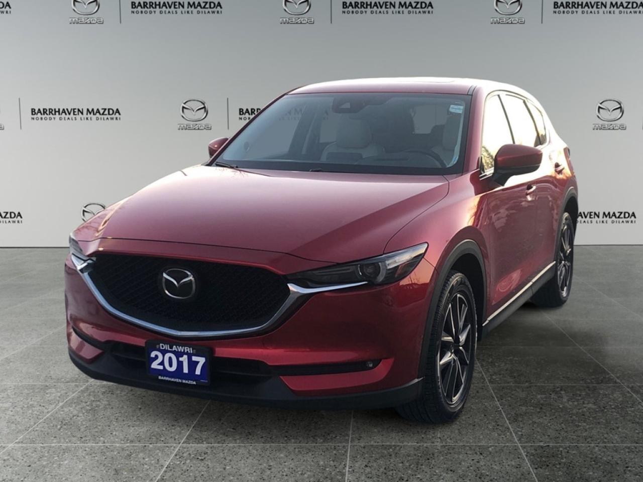 Introducing the 2017 Mazda CX-5 GT in a dynamic Red color. This AWD SUV promises a responsive handling experience paired with the convenience of Automatic transmission. The exterior impresses with its bold presence and alloy wheels, while the interior is designed for luxury and comfort, featuring leather seats and a leather/metal-look gear shifter material. Both front and rear seats are heated, increasing driving pleasure in colder months. For the tech-savvy and safety-conscious driver, this Mazda CX-5 GT is equipped with all the essentials. Enjoy the seamless integration of smart devices along with a Bluetooth connection, keeping you connected on the go. The in-car navigation system and lane assist add a layer of convenience and safety, while the backup camera and brake assist round out your comprehensive driving support. Whether youre commuting through city streets or heading on a weekend getaway, this vehicles combination of style, comfort, and cutting-edge technology is perfect for families and adventurers alike. Contact our dealership today to experience everything the 2017 Mazda CX-5 GT has to offer!