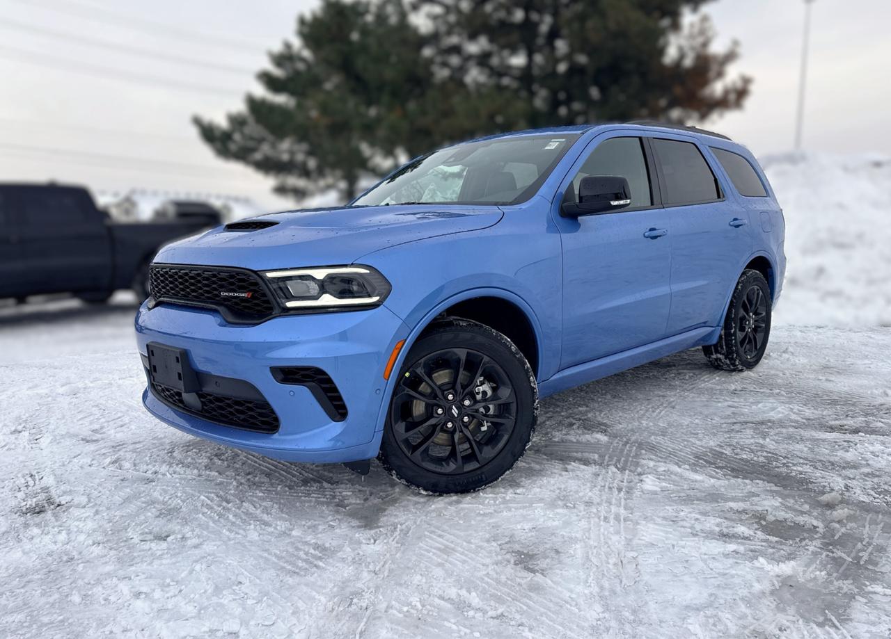 Strong and stunning, our New 2026 Dodge Durango GT Plus AWD gets family trips off to a great start in B5 Blue with the Blacktop Pack! Motivated by a 3.6 Litre Pentastar V6 supplying 295hp to a paddle-shifted 8 Speed Automatic transmission with a dedicated Sport mode. A rear load-leveling suspension helps you handle lifes challenges as this All Wheel Drive SUV achieves approximately 9.8L/100km on the highway with a dominating Dodge design. Exterior highlights include a power sunroof, LED lighting, a performance hood with built-in heat extractors, 20-inch black alloy wheels, roof rails, and a power liftgate.  Our GT Plus cabin adds rewarding comfort cues like heated/ventilated leather front seats, heated second-row seats, a versatile third row, a heated flat-bottom leather steering wheel, tri-zone automatic climate control, remote start, and keyless access/ignition. A 10.1-inch touchscreen anchors the infotainment system, which is at your service with full-color navigation, Apple CarPlay&reg;, Android Auto&reg;, Bluetooth&reg;, wireless charging, voice control, and nine-speaker Alpine audio for impressive sound reproduction.  Smart safety awaits with Dodge technologies such as adaptive cruise control, front/rear automatic braking, rearview camera, rear cross-path detection, blind-spot monitoring, rear parking sensors, trailer sway damping, lane-keeping assistance, and more. Families love the fierce nature of our fantastic Durango GT Plus! Save this Page and Call for Availability. We Know You Will Enjoy Your Test Drive Towards Ownership!