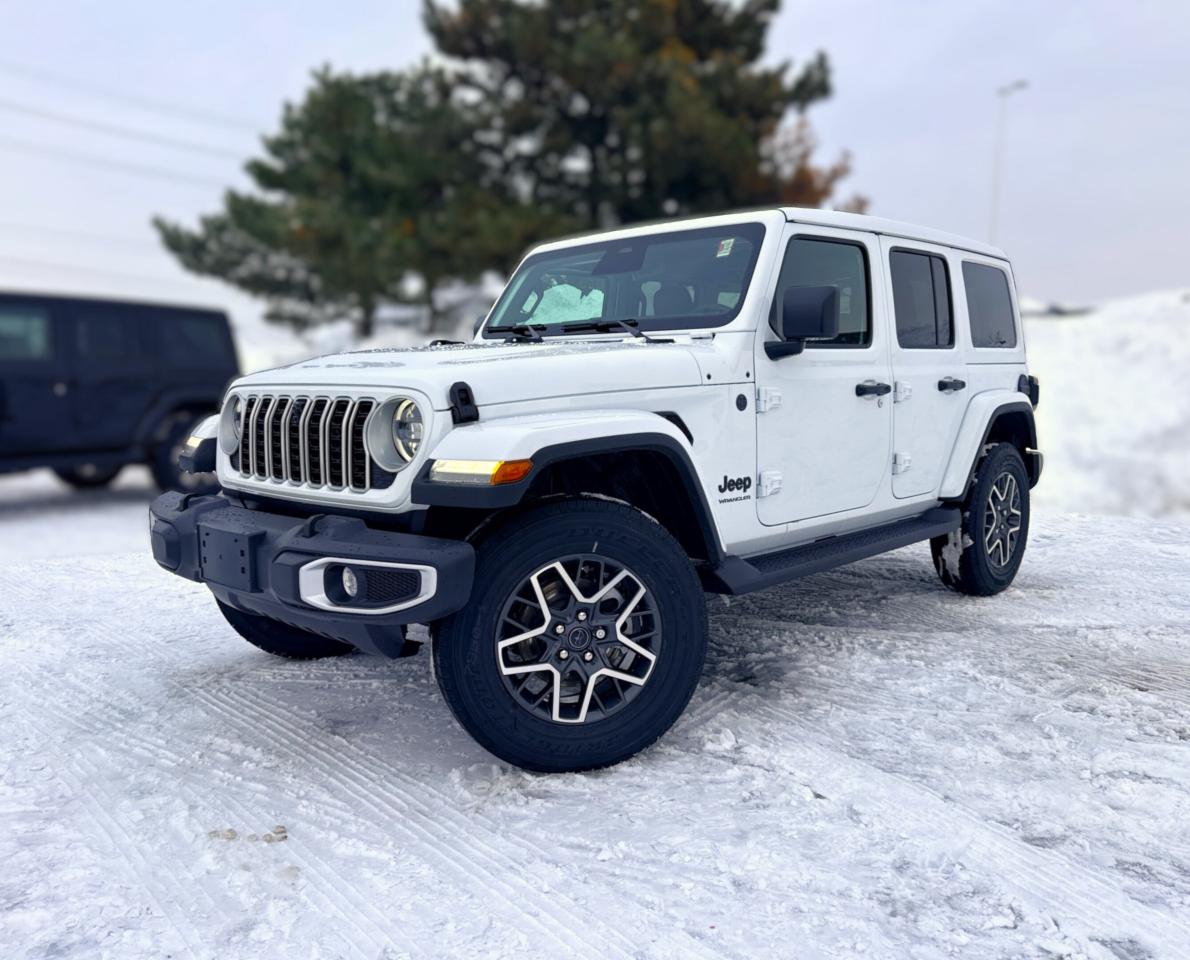 Our New 2026 Jeep Wrangler Sahara 4 Door 4X4, equipped with the Sahara Popular Equipment Package, helps owners live the adventurous life in Bright White! Powered by a 3.6 Litre Pentastar V6 generating 285hp for an 8 Speed Automatic transmission thats eager for action. Dana axles and Command-Trac 4WD raise the bar for rugged performance, and this Four Wheel Drive SUV returns approximately 10.2L/100km on the highway with an iconic exterior design. Ready for open-air freedom with a removable top and doors, our Wrangler boasts LED lighting, fog lamps, a body-color sport bar, alloy wheels, side steps, an integrated off-road camera, and robust skid plates for added off-road protection.  Upscale details, including the Sahara Popular Equipment Packs heated McKinley-Trimmed front seats, a heated-wrapped steering wheel, automatic climate control, remote start, keyless access, pushbutton ignition, and 12V/115V power outlets, add extra comfort to our Sahara cabin. Our Wrangler also impresses in the infotainment department, thanks to a 12.3-inch touchscreen, a 7-inch driver display, WiFi compatibility, Apple CarPlay&reg;, Android Auto&reg;, Bluetooth&reg;, Alpine audio, and the trail-friendly tech benefits of Off-Road Info Pages. Its a comfortable cockpit for taking command!  Smart owners demand intelligent safety, and Jeep delivers with automatic braking, adaptive cruise control, forward collision warning, ParkSense, a rearview camera, hill start assist, trailer sway damping, and more. The world awaits, and our Wrangler Sahara is ready to go! Save this Page and Call for Availability. We Know You Will Enjoy Your Test Drive Towards Ownership!