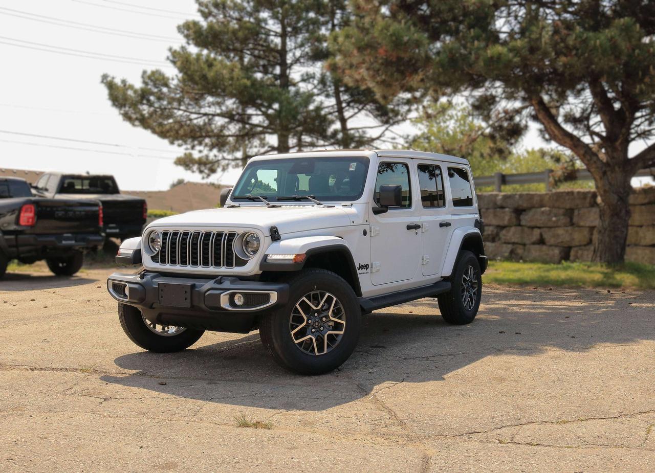 Our New 2026 Jeep Wrangler Sahara 4 Door 4X4, equipped with the Sahara Popular Equipment Package, helps owners live the adventurous life in Bright White! Powered by a 3.6 Litre Pentastar V6 generating 285hp for an 8 Speed Automatic transmission thats eager for action. Dana axles and Command-Trac 4WD raise the bar for rugged performance, and this Four Wheel Drive SUV returns approximately 10.2L/100km on the highway with an iconic exterior design. Ready for open-air freedom with a removable top and doors, our Wrangler boasts LED lighting, fog lamps, a body-color sport bar, alloy wheels, side steps, an integrated off-road camera, and robust skid plates for added off-road protection.  Upscale details, including the Sahara Popular Equipment Packs heated McKinley-Trimmed front seats, a heated-wrapped steering wheel, automatic climate control, remote start, keyless access, pushbutton ignition, and 12V/115V power outlets, add extra comfort to our Sahara cabin. Our Wrangler also impresses in the infotainment department, thanks to a 12.3-inch touchscreen, a 7-inch driver display, WiFi compatibility, Apple CarPlay&reg;, Android Auto&reg;, Bluetooth&reg;, Alpine audio, and the trail-friendly tech benefits of Off-Road Info Pages. Its a comfortable cockpit for taking command!  Smart owners demand intelligent safety, and Jeep delivers with automatic braking, adaptive cruise control, forward collision warning, ParkSense, a rearview camera, hill start assist, trailer sway damping, and more. The world awaits, and our Wrangler Sahara is ready to go! Save this Page and Call for Availability. We Know You Will Enjoy Your Test Drive Towards Ownership!