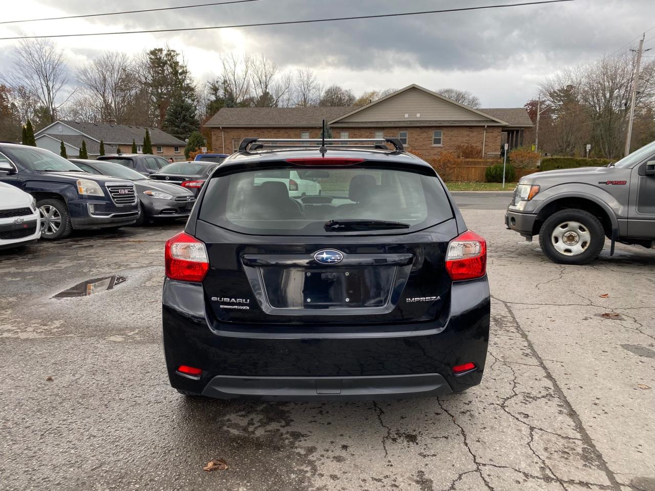 2014 Subaru Impreza 5dr HB CVT 2.0i w/Touring Pkg Photo