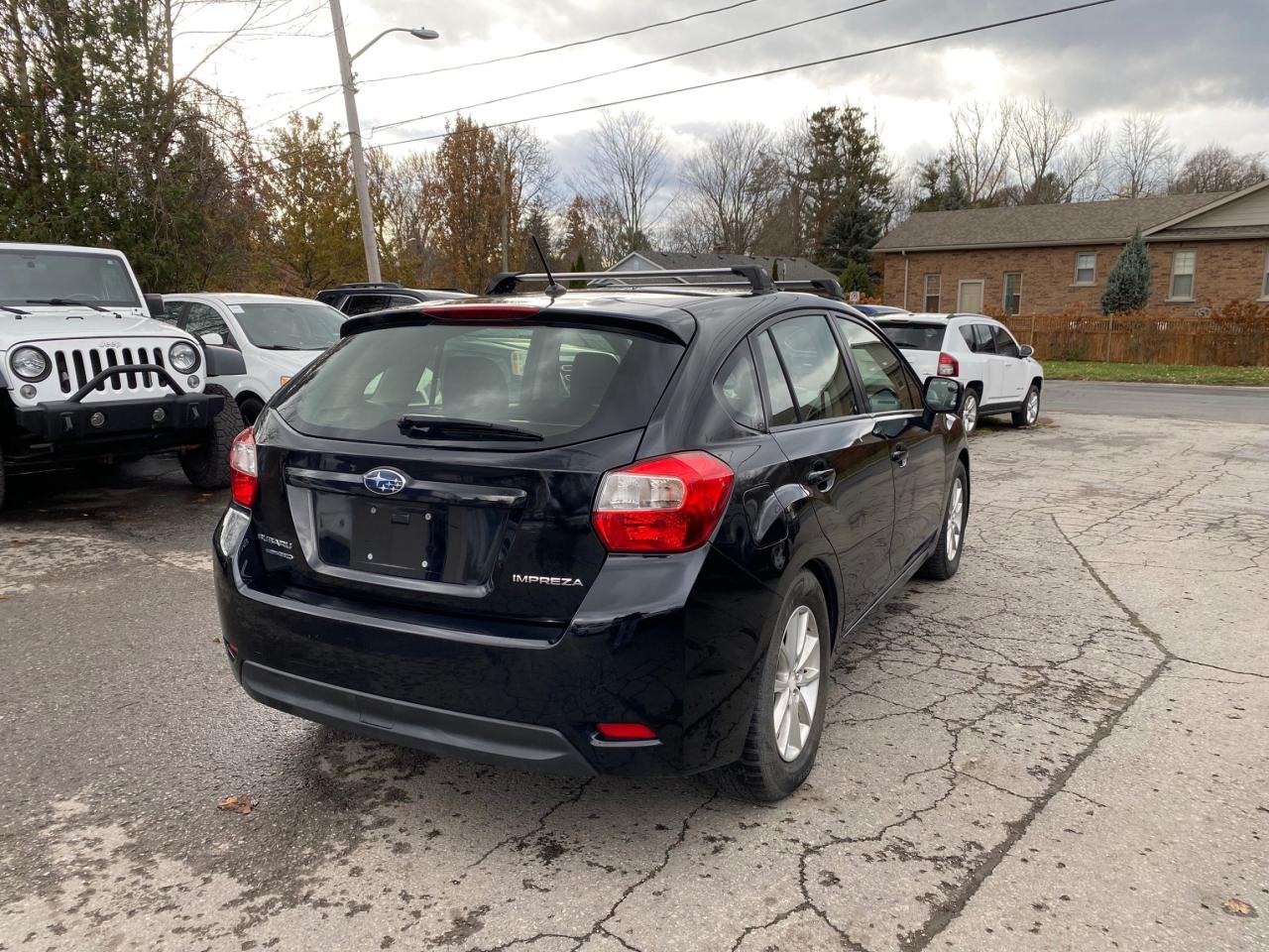 2014 Subaru Impreza 5dr HB CVT 2.0i w/Touring Pkg Photo