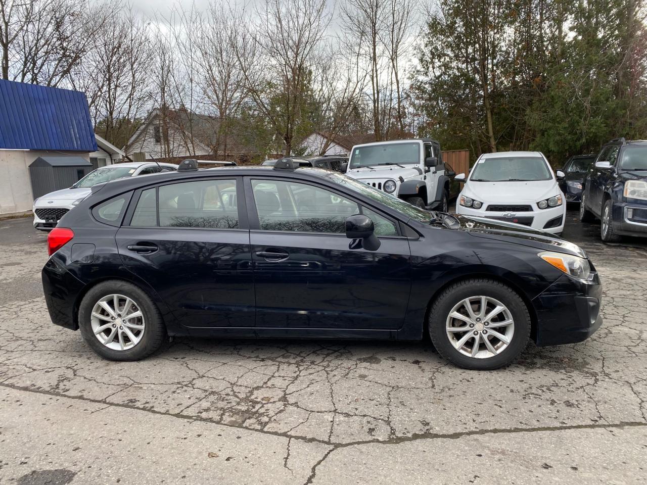 2014 Subaru Impreza 5dr HB CVT 2.0i w/Touring Pkg Photo