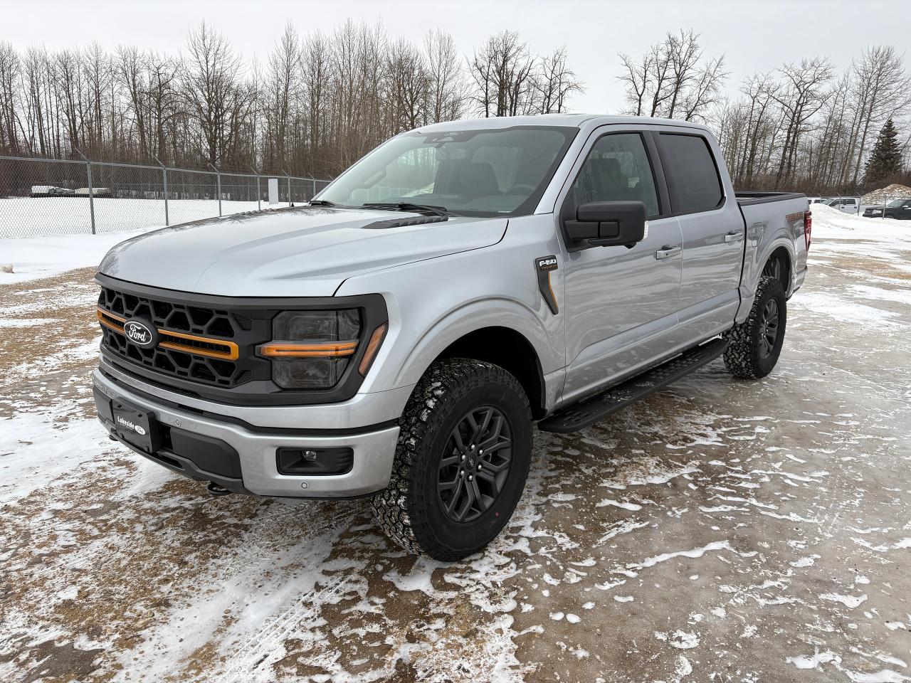 <p data-start=109 data-end=163><strong data-start=109 data-end=161>2025 Ford F-150 Tremor&reg; &ndash; Iconic Silver Metallic</strong></p><p data-start=165 data-end=697>The 2025 Ford F-150 Tremor&reg; in Iconic Silver Metallic is built for adventure and capability. Its rugged exterior features LED reflector headlamps, LED fog lamps, daytime running lights, dual exhaust, and fully boxed steel frame with unique front knuckles. The 18&Prime; alloy wheels with dark matte finish, pickup box tie-down hooks, skid plates, and a 5-1/2&rsquo; box make this truck ready for any terrain or load. The Power Tailgate Lock, Easy Fuel&reg; capless filler, zone lighting, and illuminated entry add convenience to its tough design.</p><p data-start=699 data-end=1174>Inside, the F-150 Tremor&reg; cabin is comfortable and tech-forward with a 12&Prime; productivity screen, dual-zone electronic A/C, tilt/telescoping steering wheel, dual visors with mirrors, and power locks/windows. The unique Black Sport Cloth 40/Console/40 seating provides durability for work or play. Adaptive cruise control, rear view camera, reverse sensing system, and Intelli Access with push start (via SYNC4&reg; with 12&Prime; screen) ensure a connected and safe driving experience.</p><p data-start=1176 data-end=1661>Safety features include Safety Canopy&reg;, post-collision braking, advanceTrac&reg; with roll stability control, tire pressure monitoring system, SOS post-crash alert, BLIS&reg; with cross-traffic alert, lane keeping system, pre-collision assist with automatic emergency braking, and reverse brake assist. Additional towing and utility support comes from the Pro Trailer Hitch Assist, Pro Trailer Backup Assist, 4x4 electronic shift-on-the-fly system, tow/haul package, and bed utility package.</p><p data-start=1663 data-end=2005>Tech and convenience are enhanced with FordPass Connect, while BlueCruise&trade; hands-free driving technology comes with a 90-day trial and optional 1-year plan. Backed by a 3-year/60,000 km basic warranty, 5-year/100,000 km powertrain warranty, and 24-hour roadside assistance, this F-150 Tremor&reg; is ready for every journey, on or off the road.</p>