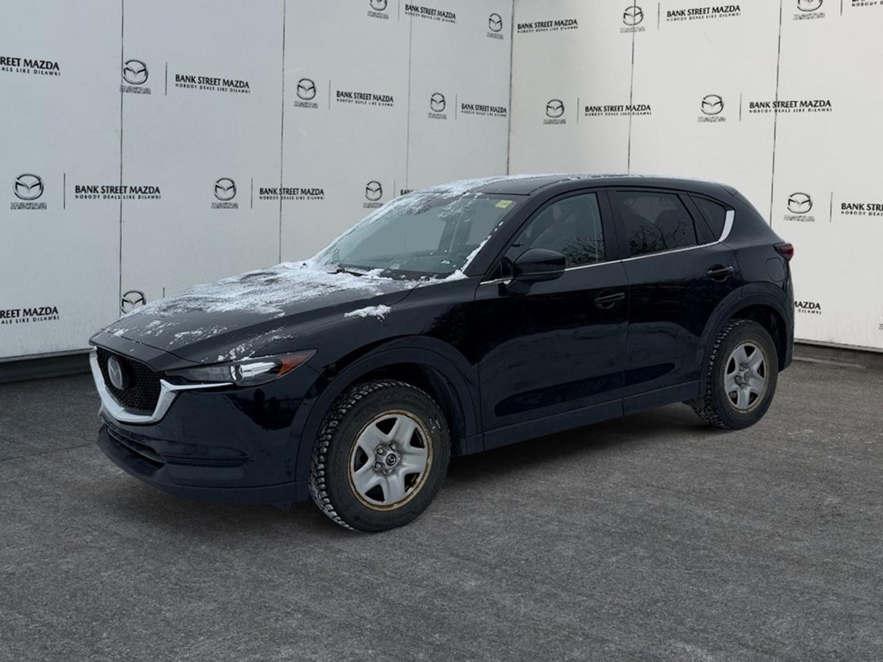 The 2020 Mazda CX-5 GS in a sleek body, combined with its AWD drivetrain, offers superb handling for drivers who crave both style and performance. Its stunning SUV profile is complemented by stylish alloy wheels and heated mirrors. Step inside and youll find a harmonious interior that features a leather steering wheel and leatherette door trim insert, enhancing the sophisticated ambiance. Enjoy the convenience of power seats and power windows, as well as the added luxury of heated front seats and a heated steering wheel, perfect for Canadian winters. Stay connected and entertained on the go with smart device integration and Bluetooth connection accessible through the user-friendly infotainment system. Safety takes center stage with advanced features like a backup camera, brake assist, and lane assist technology. Adaptive cruise control is also at your service for easy long-distance drives. This Mazda CX-5 GS model caters to individuals and families seeking a reliable, stylish, and feature-rich vehicle. Dont miss the chance to own this extraordinary SUV  contact our dealership today to schedule a test drive and explore your financing options.