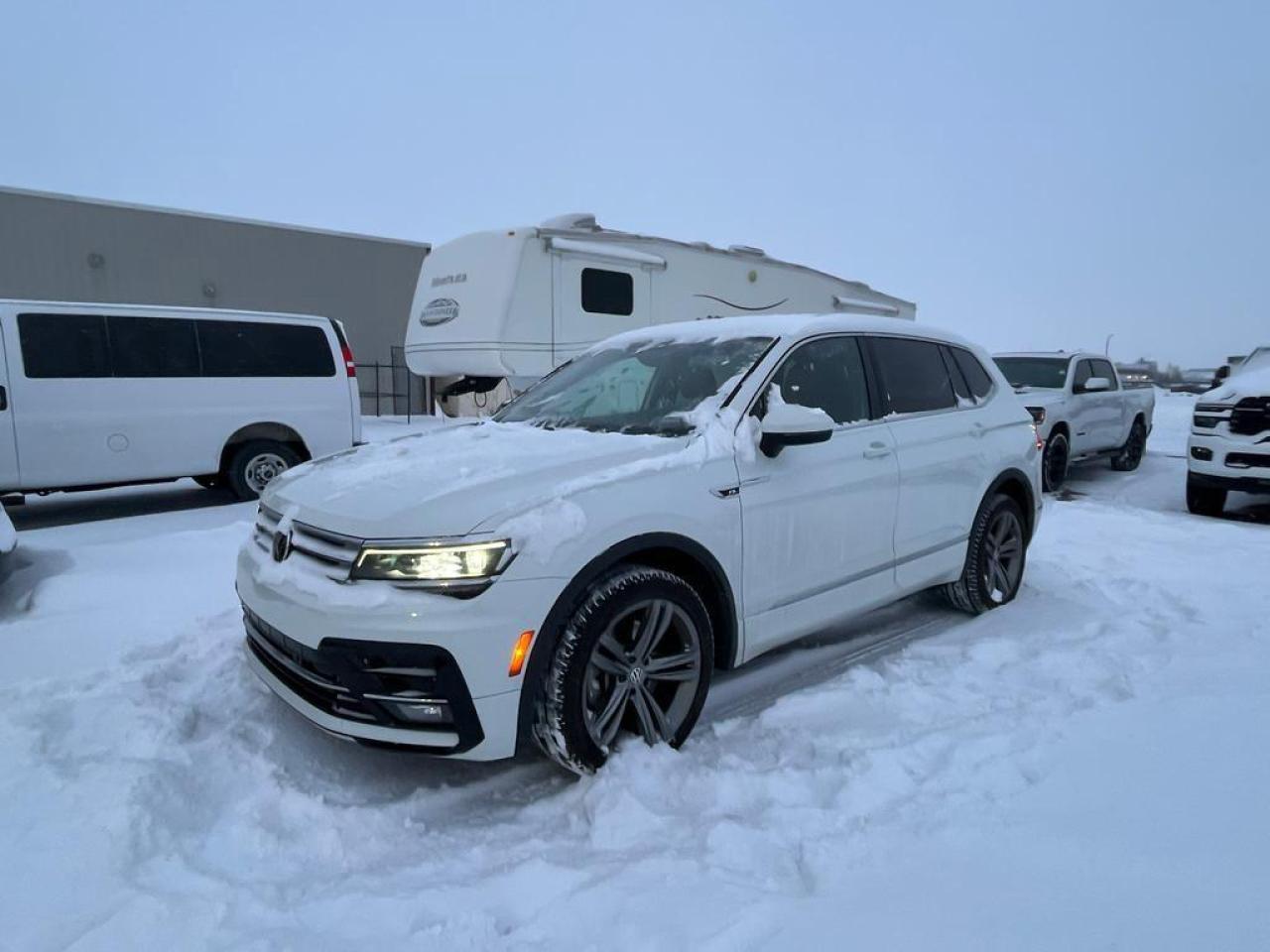 <b>Leather - Navigation - Sunroof - Heated Seats - Bluetooth - Remote Start - AWD <br /> <br /></b><br /> With a new more aggressive and distinct design, this 2018 Volkswagen Tiguan has become even better than before. This 2018 Volkswagen Tiguan is fresh on our lot in Lethbridge. <br /> <br />The 2018 Volkswagen Tiguan is completely redesigned and much more refined this year. With a more aggressive and masculine front hood, and all around design tweaks, the new Tiguan is becoming the undisputed king of the city streets. There is more of everything in the new Tiguan including more legroom, more options to choose from and more power. The new and improved Tiguan is the best choice for a new compact SUV.This SUV has 83,058 kms. Stock number 40843 is white in colour . It has an automatic transmission and is powered by a 184HP 2.0L 4 Cylinder Engine. It may have some remaining factory warranty, please check with dealer for details. <br /> <br /> Our Tiguan's trim level is Highline 4MOTION. Towering above the competition, this luxuriously fitted out Tiguan Highline 4MOTION has all the best gadgets and features VW has to offer. Options include upgraded stylish aluminum wheels, power sunroof with sunshade, roof rack rails, LED brake lights, front fog lamps, Fender Digital Audio system with 8 speakers, satellite navigation, voice control, App-Connect smart phone integration, SiriusXM, Bluetooth, heated power front seats, leather upholstered seats front and rear, proximity entry, push button start, cruise control, dual zone front automatic air, door mirrors and drivers seats memory control, blind spot sensor, back up camera, forward and rear collision alerts, front and rear parking sensors and much more. This vehicle has been upgraded with the following features: Navigation, Sunroof, Leather Seats, Heated Seats, Premium Sound Package, Rear View Camera, Bluetooth. <br /> <br />To apply right now for financing use this link : <a href=https://www.bridgecitychrysler.com/pre-approval/ target=_blank rel=nofollow noopener noreferrer>https://www.bridgecitychrysler.com/pre-approval/</a><br /><br /> <br /><br />Locally Owned & Trusted for Over 35 Years  Bridge City Chrysler in Lethbridge, AB <br /><br /> At Bridge City Chrysler, weve proudly served the Lethbridge community for more than 35 years, offering an unparalleled car buying experience. Dont just take our word for itour Google reviews speak volumes about our commitment to exceptional service. <br /><br /> Delivery & At-Home Test Drives: Convenient options to suit your lifestyle. <br /><br /> Flexible Financing for Everyone: Get the vehicle you need with financing solutions tailored to your situation. <br /><br /> Full Mechanical Inspections & Professional Cleaning: Every vehicle is thoroughly inspected and cleaned before it hits our lot.<br /><br /> We take all makes and models on trade and offer competitive pricing with inventory that changes daily. Whether you're shopping for a Chrysler, Dodge, Jeep, RAM, or FIAT, our AMVIC Licensed dealership makes it easy to browse, buy, and drive away.<br /><br /> Located in Lethbridge, AB, we proudly serve customers in Fort Macleod, Taber, Claresholm, and Coaldale. Shop online or visit us today to experience the best in sales, service, and selection. Standard bank rates apply; taxes are additional.<br /><br /> Vehicle pricing offer shown expire 2025-12-31. <br /> Come by and check out our fleet of 100+ used cars and trucks and 140+ new cars and trucks for sale in Lethbridge. o~o