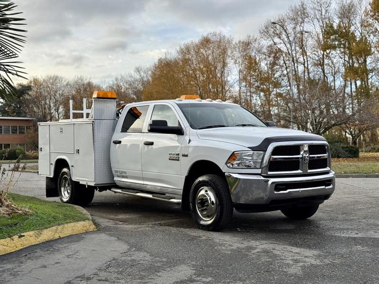 This 2013 Ram 3500 crew cab 4x4 DRW service truck is equipped with a 5.7L 8-cylinder engine, automatic transmission and four-wheel drive, and features a white exterior with a grey cloth interior. It includes storage compartments, a beacon light, 4x4 gear selector, tow/haul mode, auxiliary switches, cup holders, 12V inputs, air conditioning and heat, and an AM/FM radio, along with power windows, power door locks and power mirrors. The rear service box area measures approximately 7 feet 5 inches long, 4 feet 5 inches wide and 2 feet 7 inches high. Overall vehicle dimensions are about 23 feet 1 inch long, 8 feet 1 inch wide and 7 feet 3 inches high, with a GVWR of 5,670 kg (12,500 lb).  $36,720.00 plus $375 processing fee, $37,095.00 total payment obligation before taxes.   Listing report, warranty, contract commitment cancellation fee, financing available on approved credit (some limitations and exceptions may apply). All above specifications and information is considered to be accurate but is not guaranteed and no opinion or advice is given as to whether this item should be purchased. We do not allow test drives due to theft, fraud, acts of vandalism and undetectable impaired driving. Instead we provide the following benefits: Complimentary Warranty (with options to extend), Limited Money Back Satisfaction Guarantee on Fully Completed Contracts, Contract Commitment Cancellation, and an Open-Ended Sell-Back Option. Ask seller for details or call 604-522-REPO(7376) to confirm listing availability.