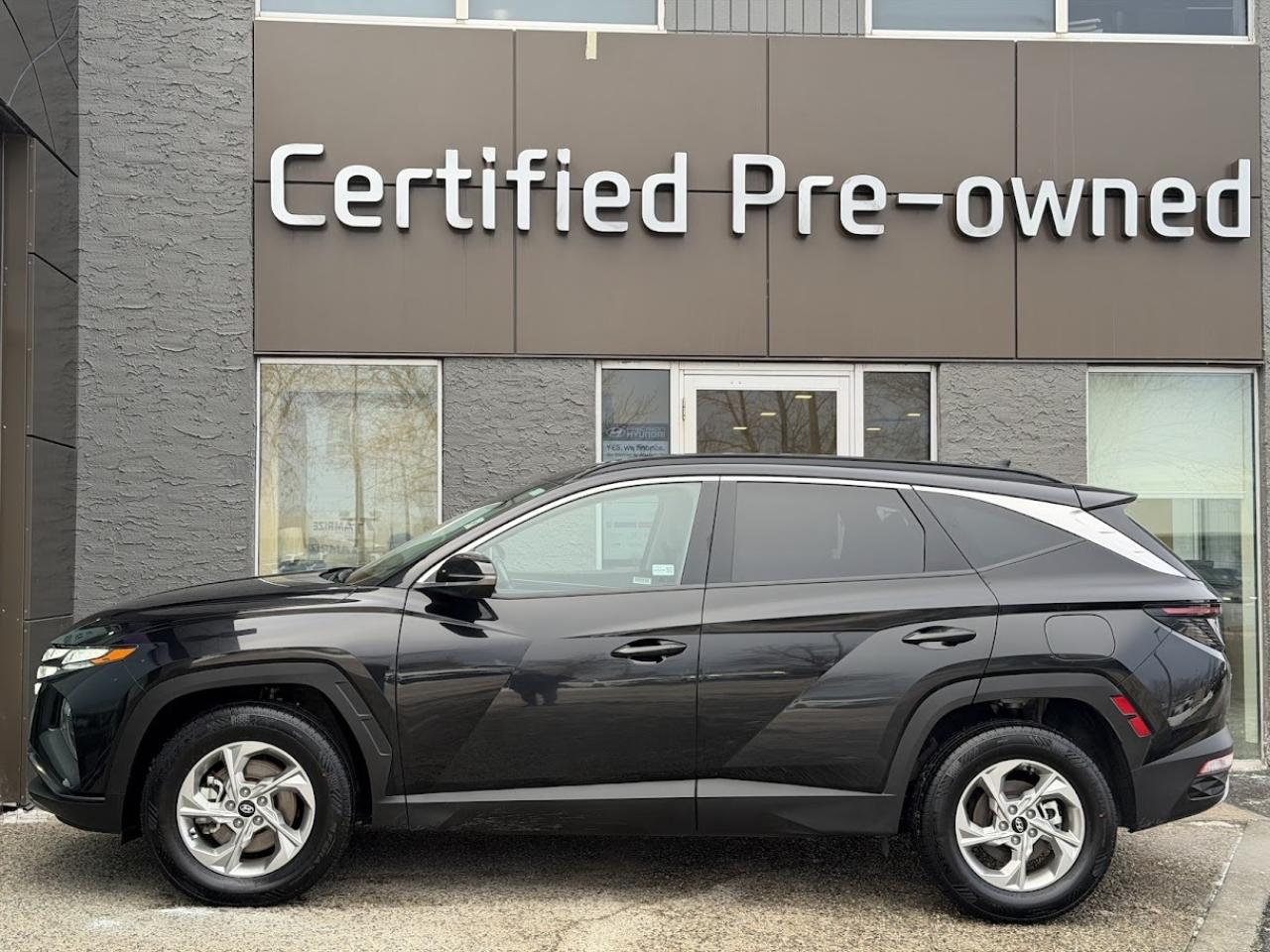 This LOW KM Hyundai Tucson TREND comes loaded with a fuel efficient and responsive 2.5L motor, automatic transmission with selectable drive modes, an amazing HTRAC ALL WHEEL DRIVE system with multi-terrain modes, PANORAMIC ROOF, SMART power liftgate, heated black leather seats with power drivers seat, LED daytime running lights, alloy wheels, automatic LED headlights, 10.25-inch touchscreen with NAVIGATION / APPLE CARPLAY / ANDROID AUTO, Bluetooth phone & audio connectivity, 60/40 split folding rear seats, Hyundais Bluelink, proximity key with push start ignition, heated leather wrapped steering wheel, dual-zone automatic climate control, Forward Collision Avoidance Assist, Lane Follow Assist, Lane Departure Warning, Lane Keep Assist, High Beam Assist, Blind Spot Detection system, rear-cross traffic collision assist, back-up camera and much more!!!