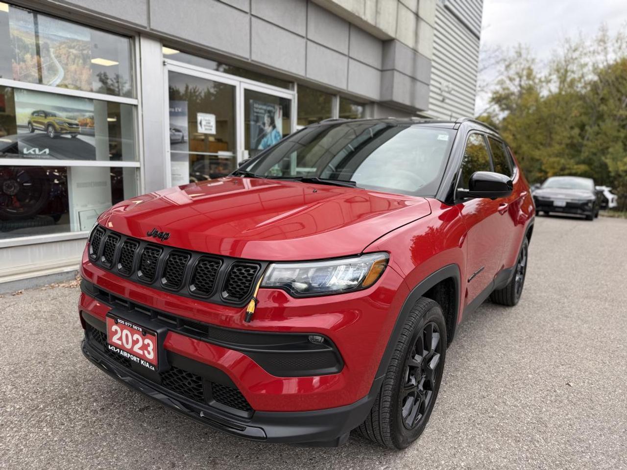Odometer is 32134 kilometers below market average!  Redline Pearlcoat 2023 Jeep Compass Altitude 4WD  8-Speed Automatic 2.0L I4 DOHC 4WD, 2nd-Row USB A/C Charging Port, 360 Degree Surround View Camera System, A/C w/Dual-Zone Auto Temp Control, Adaptive Cruise Control w/Stop & Go, Auto-Dimming Rear-View Mirror, Blind-Spot/Rear Cross-Path Detection, Convenience Group, Driver Assistance Group, Foot Activated Open N Go Liftgate, Humidity Sensor, Parallel & Perpendicular Park/Unpark, ParkSense Front & Rear Park Assist, Power Liftgate, Premium LED Fog Lamps, Quick Order Package 29B Altitude, Reversible Carpet/Vinyl Cargo Mat, Universal Garage Door Opener, Wireless Charging Pad.    **ABOVE IS THE SPECIAL FINANCING PRICE, $1500 MORE FOR CASH PURCHASES** PLEASE CALL AHEAD TO CHECK AVAILABILITY** We believe in a haggle-free environment and provide our best price upfront. We compare our vehicles with competing inventory and adjust our prices daily. At Airport Kia, our team is dedicated to providing exceptional customer service and making your car buying and ownership experience as smooth and enjoyable as possible. From our knowledgeable sales associates who are always ready to help you find the perfect vehicle for your needs and budget, to our expert technicians who are committed to keeping your Kia running smoothly and efficiently, our team is here to meet all of your automotive needs and exceed your expectations. Were proud to be a family-owned dealership, and we treat every customer like family too. That means personalized service tailored to your needs, a warm and welcoming atmosphere, and a commitment to honesty, integrity, and transparency in all of our interactions. So when you choose Airport Kia, you can rest assured that youre in good hands with our team. Visit us today at 3295 Derry Road East, Mississauga, Ontario L4T 1A8 or give us a call at 905-677-5678 to experience the Airport Kia difference for yourself.      Airport Kia is proud to serve Toronto, Ottawa, Mississauga, Brampton, Hamilton, London, Markham, Vaughn, Kitchener, Richmond Hill, Burlington, Sudbury, Oshawa, Barrie, St. Catharines, Guelph, Cambridge, Kingston, Thunder Bay, Waterloo, Brantford, Pickering, Niagara Falls, Peterborough, Sault Ste. Marie, Sarnia, North Bay, Belleville, Timmins, Woodstock, St. Thomas, Stratford, Orillia, Owen Sound. Aurora, Milton, Oakville, Parry Sound, Whitby. Our used car may include: Mercedes-Benz, Sprinter, AMG, BMW, MINI, Jaguar, Land Rover, Chrysler, Dodge, Jeep, RAM, FIAT, Ford, Lincoln, Honda, Lexus, Toyota, Mazda, Chevrolet, Buick, GMC, and Corvette, With over 23 brands we look forward to serving all your automotive needs!