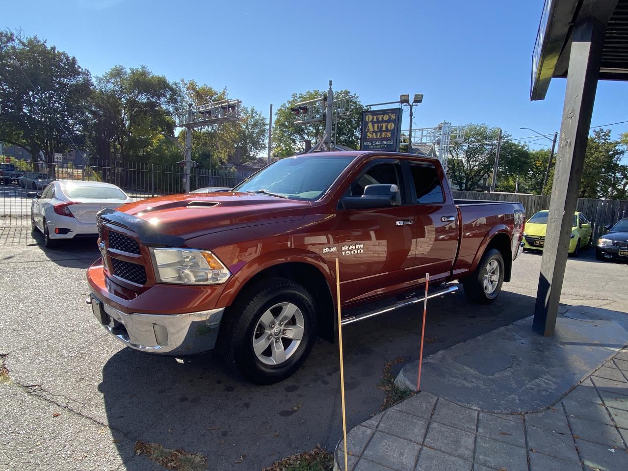 2013 RAM 1500 4WD Quad Cab 140.5  Outdoorsman Photo