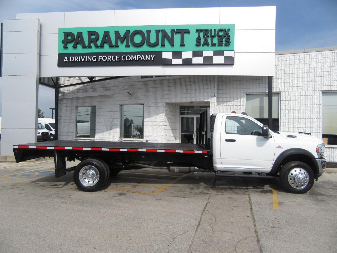 2024 RAM 5500 DIESEL REGULAR CAB WITH 16 FT WOOD FLAT DECK Photo