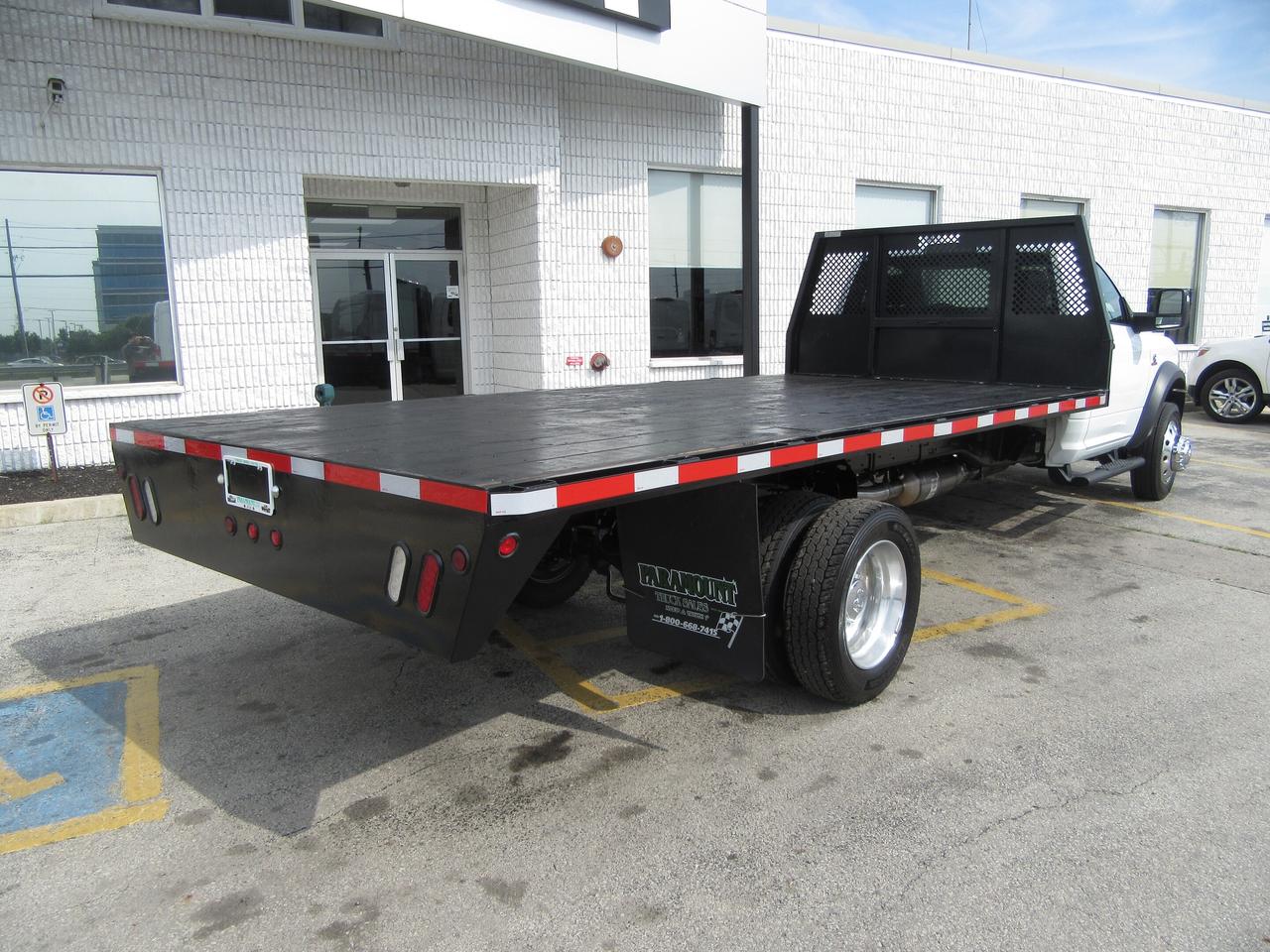 2024 RAM 5500 DIESEL REGULAR CAB WITH 16 FT WOOD FLAT DECK Photo