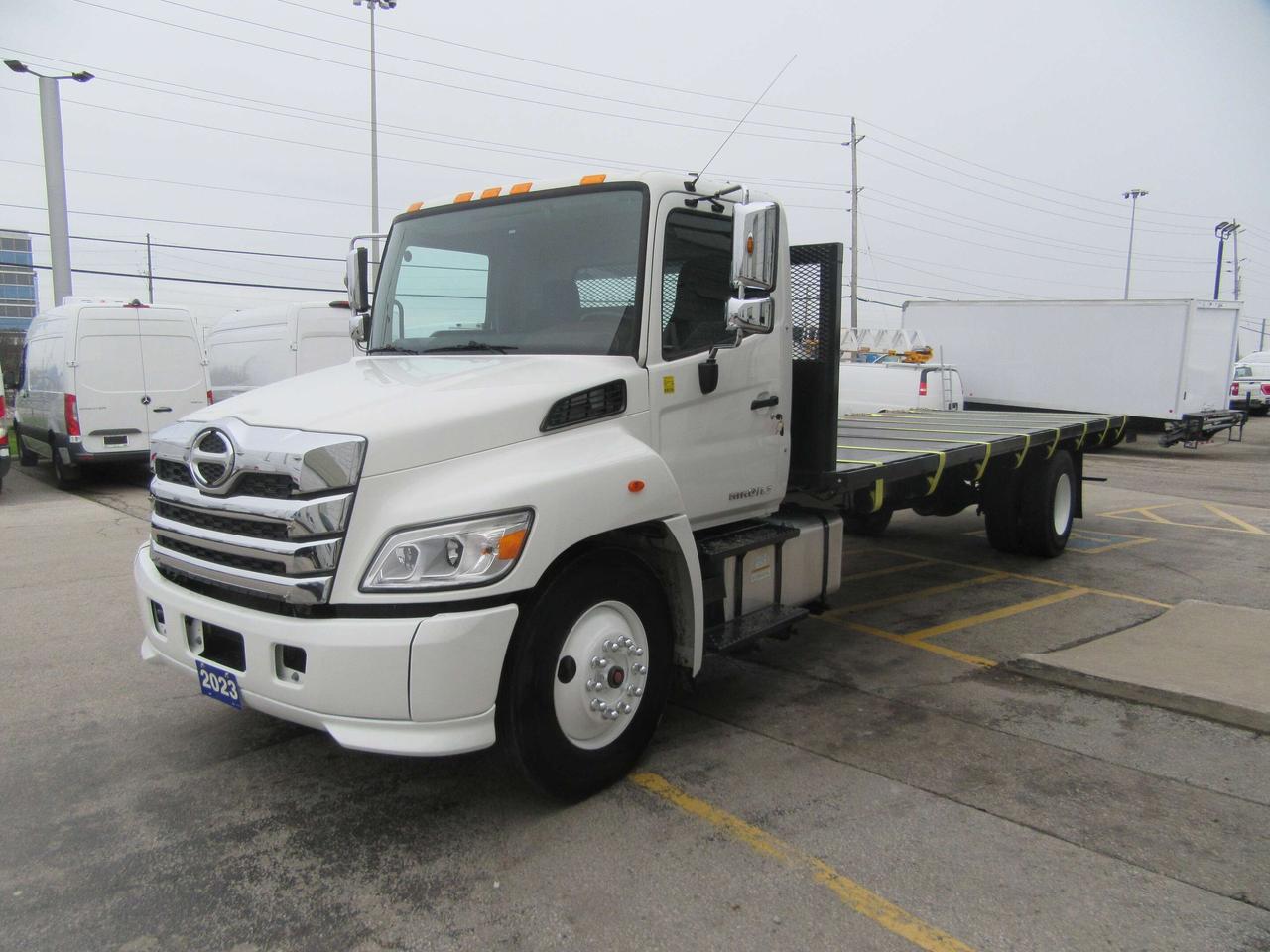 2023 Hino L7 DIESEL NEW 26FT FLAT DECK & TIE STRAP PKG Photo