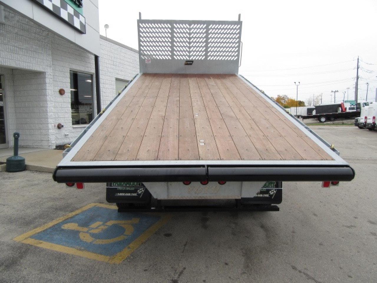 2024 RAM 5500 DIESEL 4X4 REG CAB 16 FT LUMBER DUMPING FLAT DECK Photo
